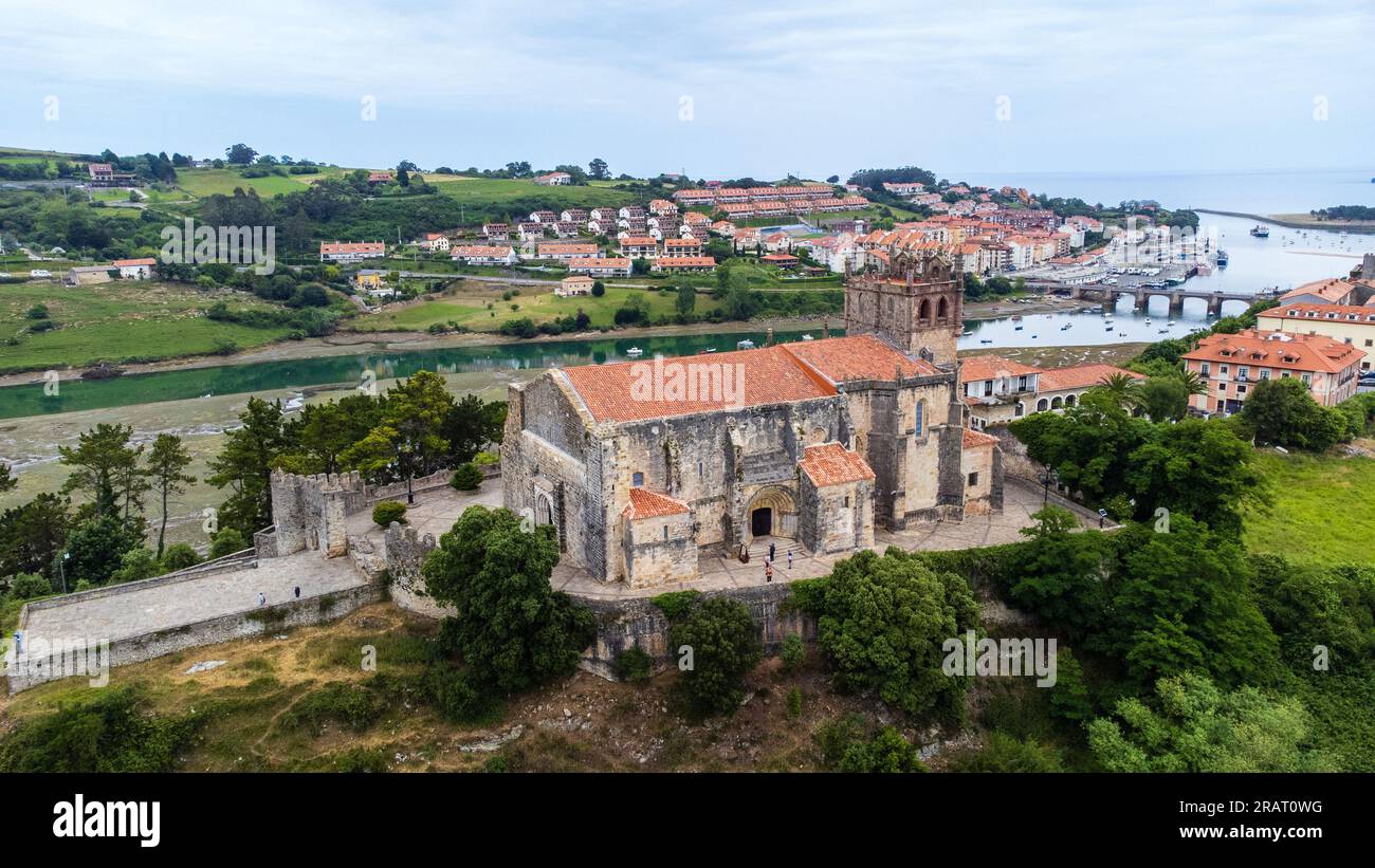 Aerial view of the Church of Santa María de los Ángeles, river and town in the background. San Vicente de la Barquera, Cantabria, Spain. Stock Photo