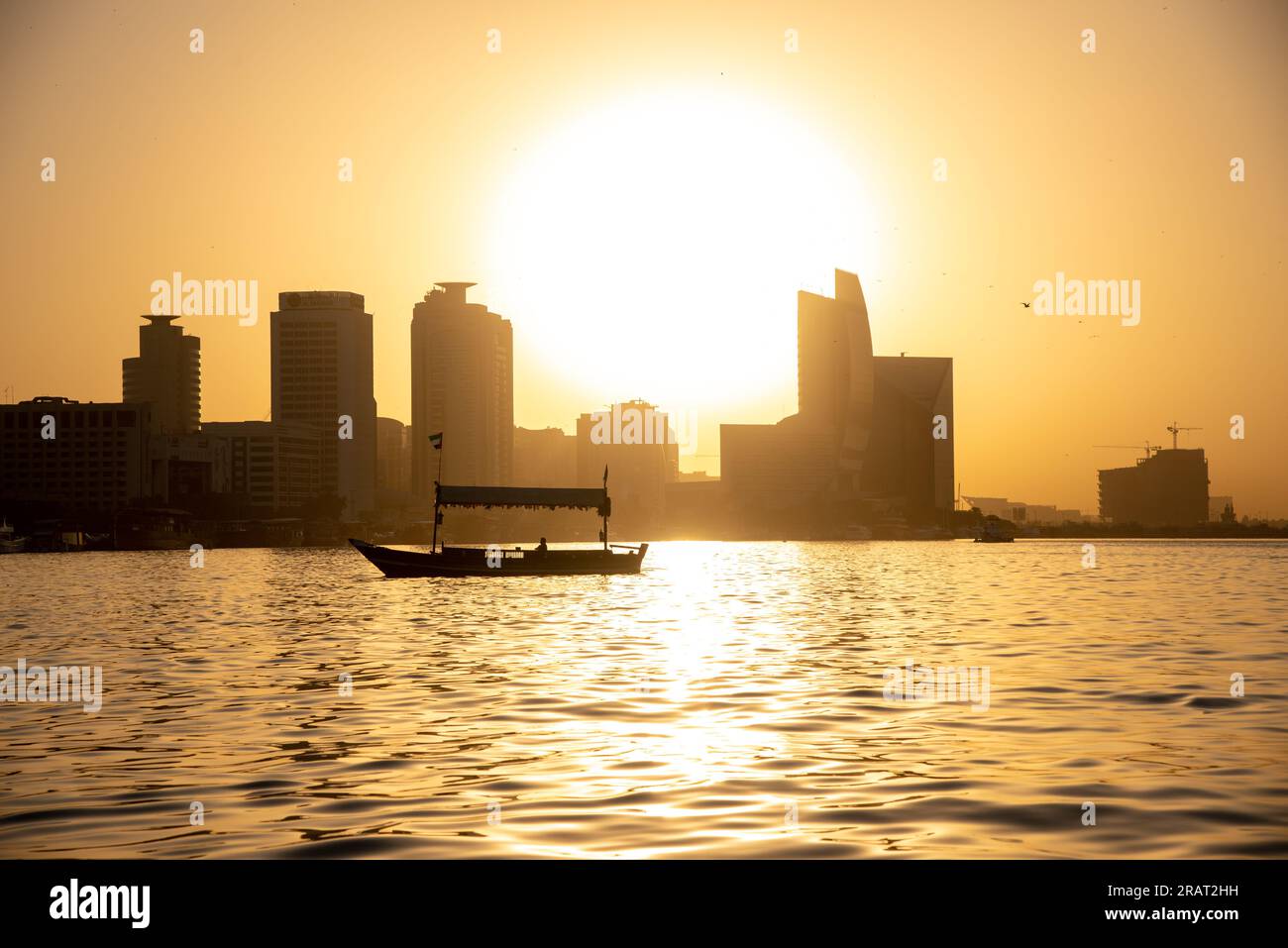 View of a sailboat during sunset at Dubai creek Stock Photo