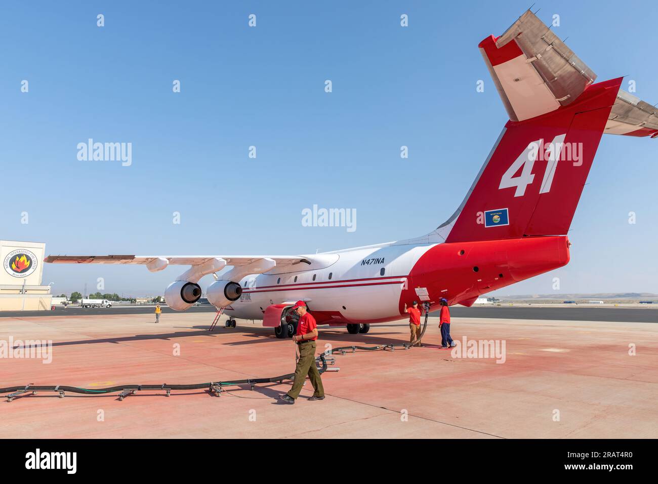 A ground crew loads fire retardant into an air tanker at the Boise Tanker Base. Photo by Neal Herbert, DOI Stock Photo