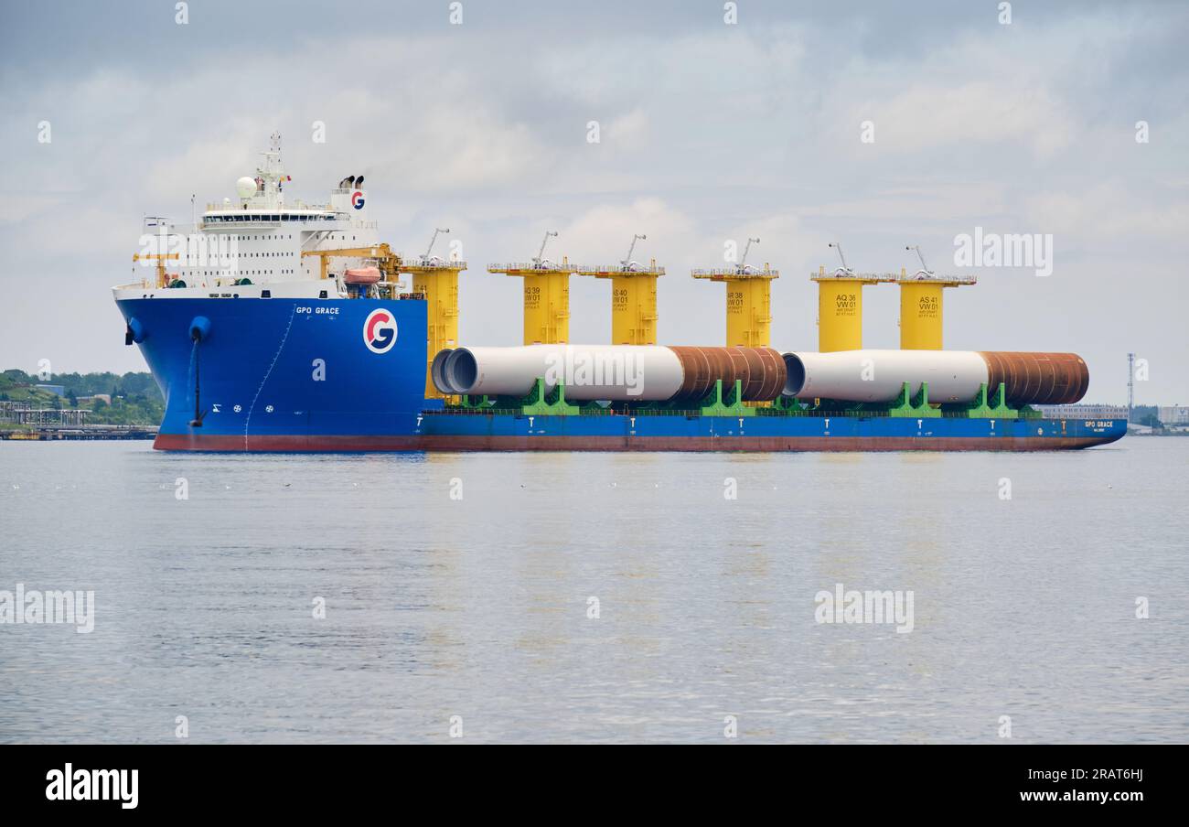 Halifax, Nova Scotia, Canada. July 5th, 2023. The GPO Grace, a Heavylift vessel, loaded with wind turbine monopiles destined for the USA's first utility-scale offshore wind energy project off the coast of Massachusetts enters the Port of Halifax where the project has set up part of its staging area. Stock Photo