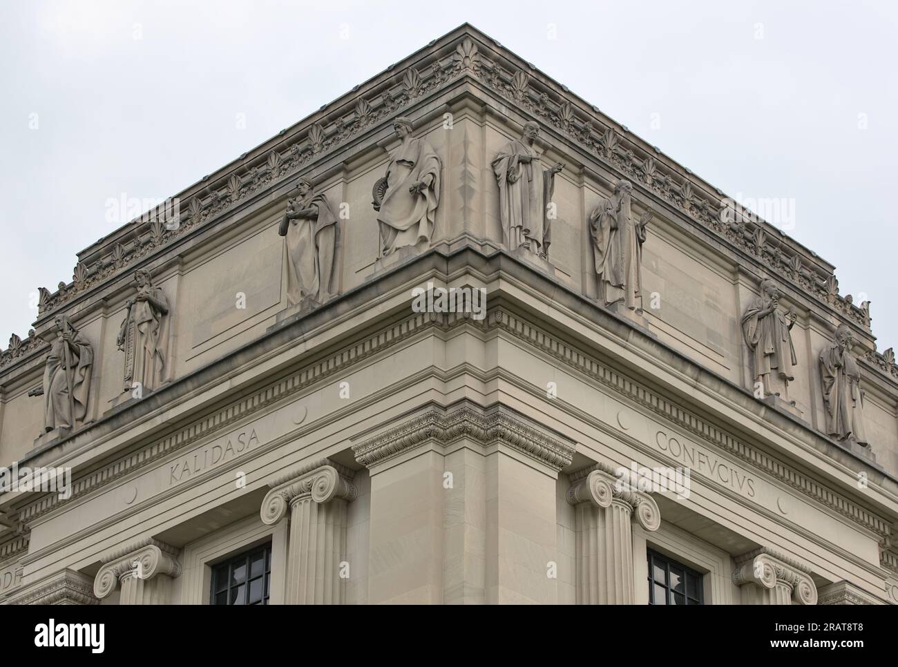 Multiple statues of historical and religious figures on the facade of