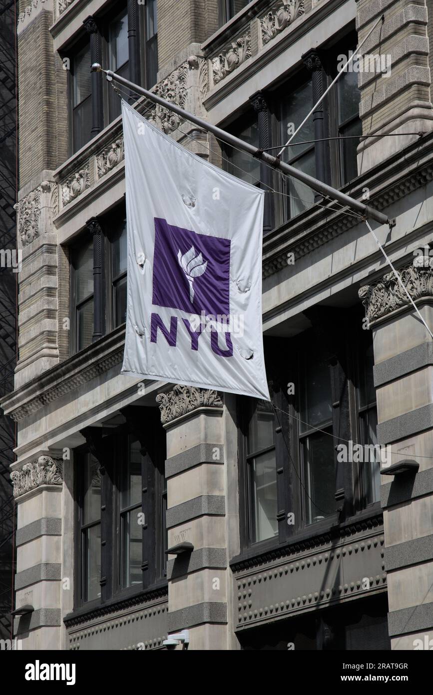 New York, NY - June 24 2023: NYU flag on the side of a building (New York University Logo) in Greenwich Village, Manhattan. Stock Photo