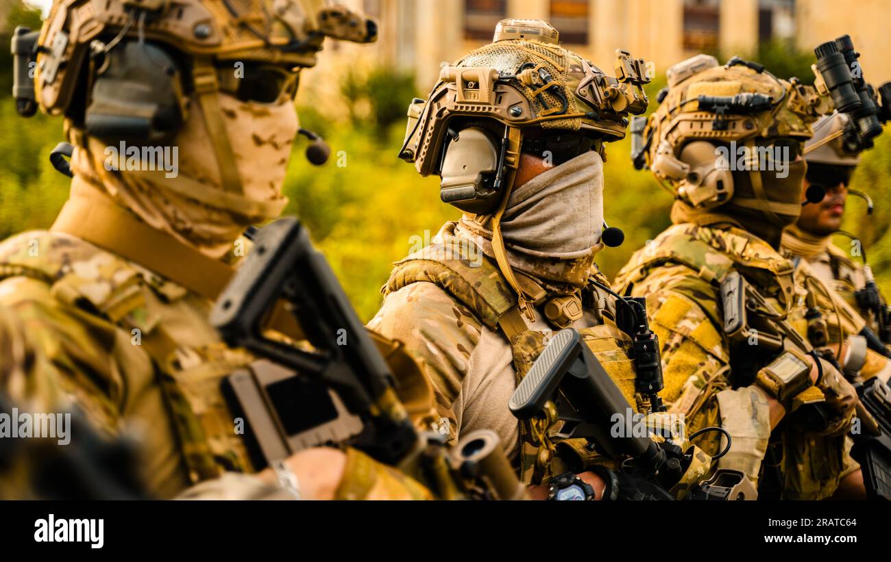 Smart teamwork of soldiers running forward and attacking enemy during ...