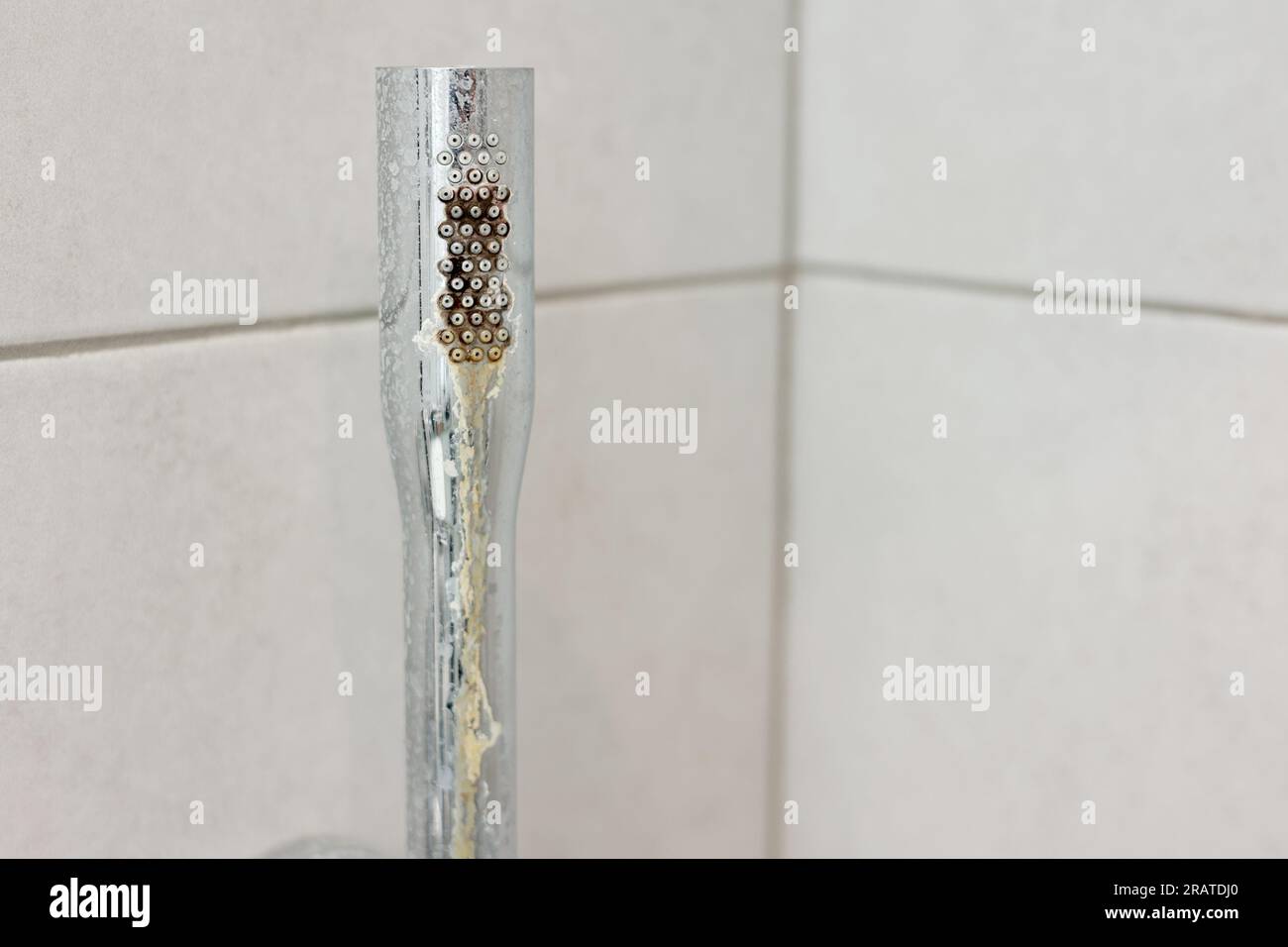 Dirty calcified shower chrome mixer tap, faucet with limescale on it