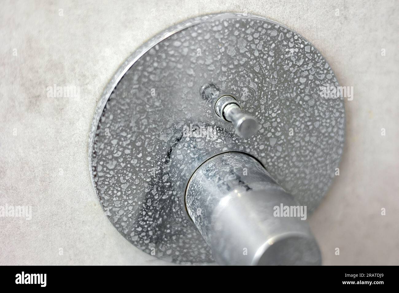 Dirty calcified shower mixer tap, faucet with limescale on it, plaque