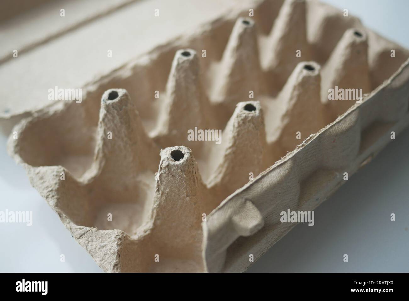 egg carton without eggs on table , Stock Photo