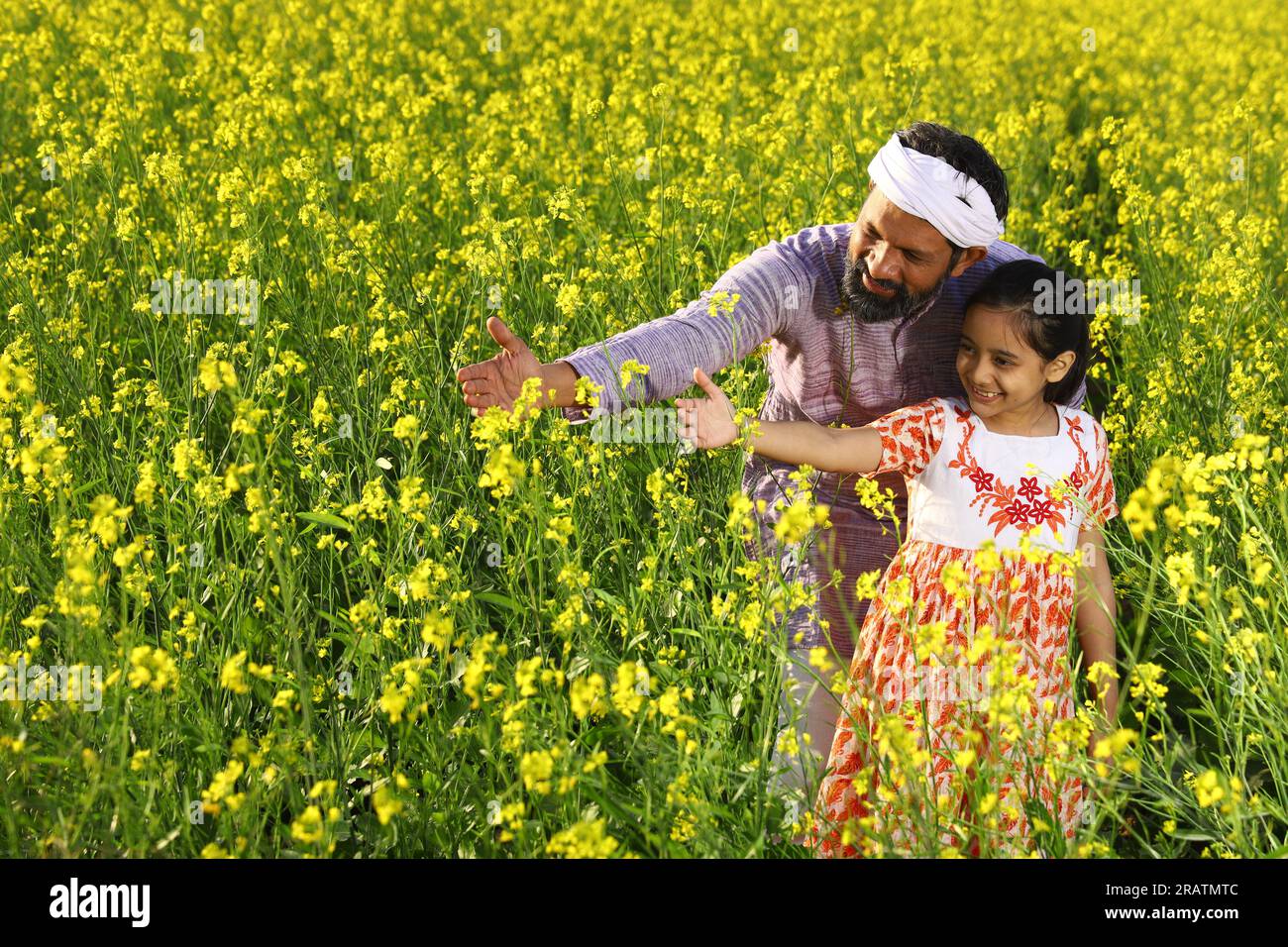 Indian rural happy farmers. Father and daughter in mustard field ...