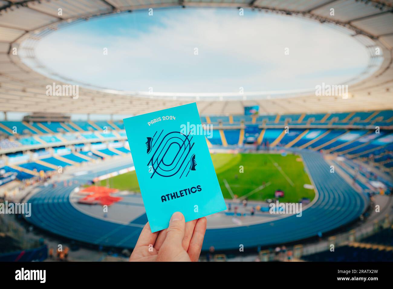 PARIS, FRANCE, JULY 7, 2023 Athlete Holds Iconic Symbol of Track and