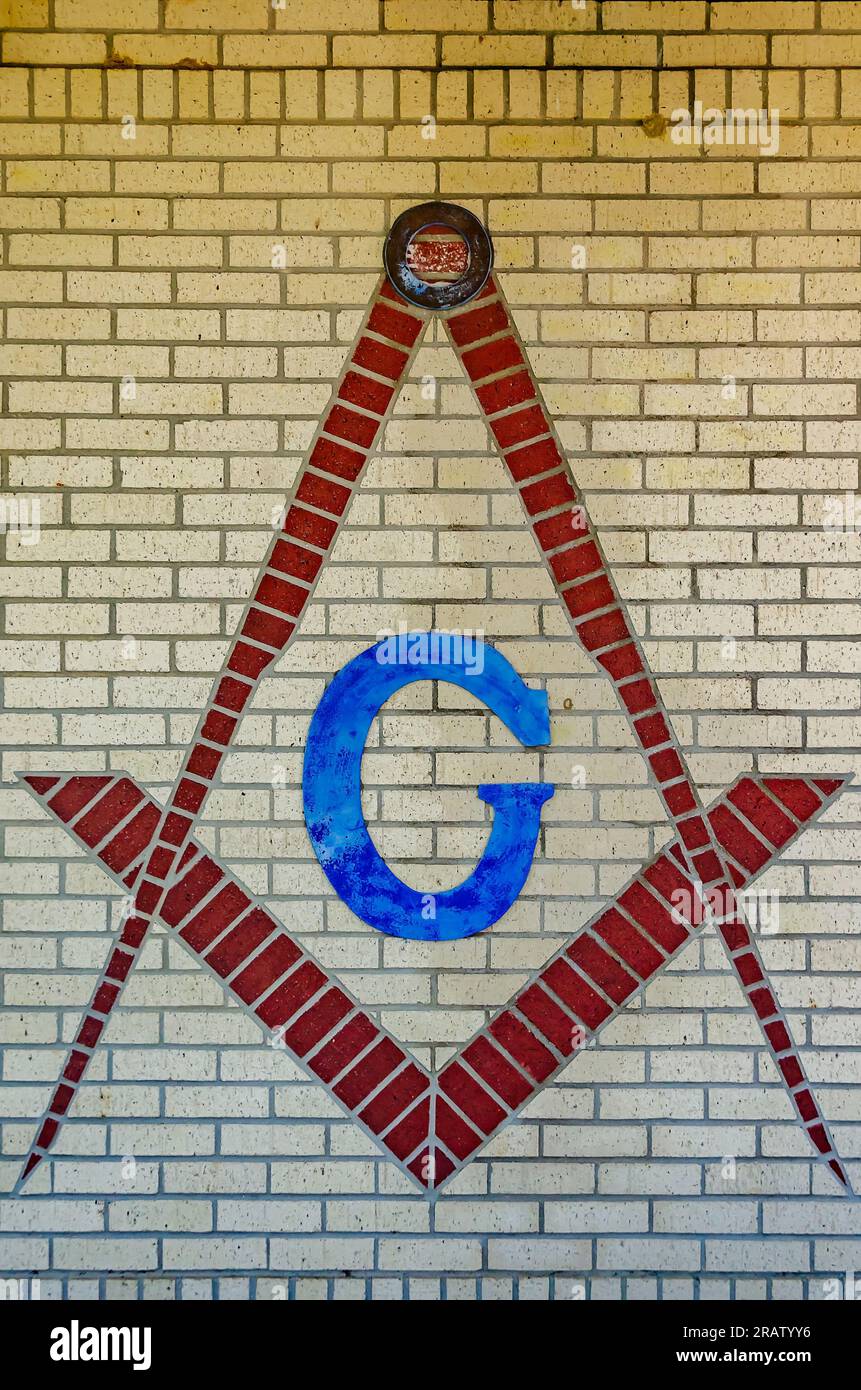 The Square and Compasses, a symbol of the Freemasons, is painted on the side of the Blumer Building, June 24, 2023, in Moss Point, Mississippi. Stock Photo