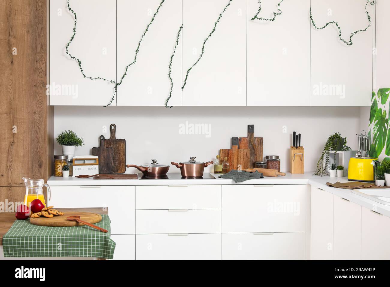 Interior of modern kitchen with white counters and utensils Stock Photo ...