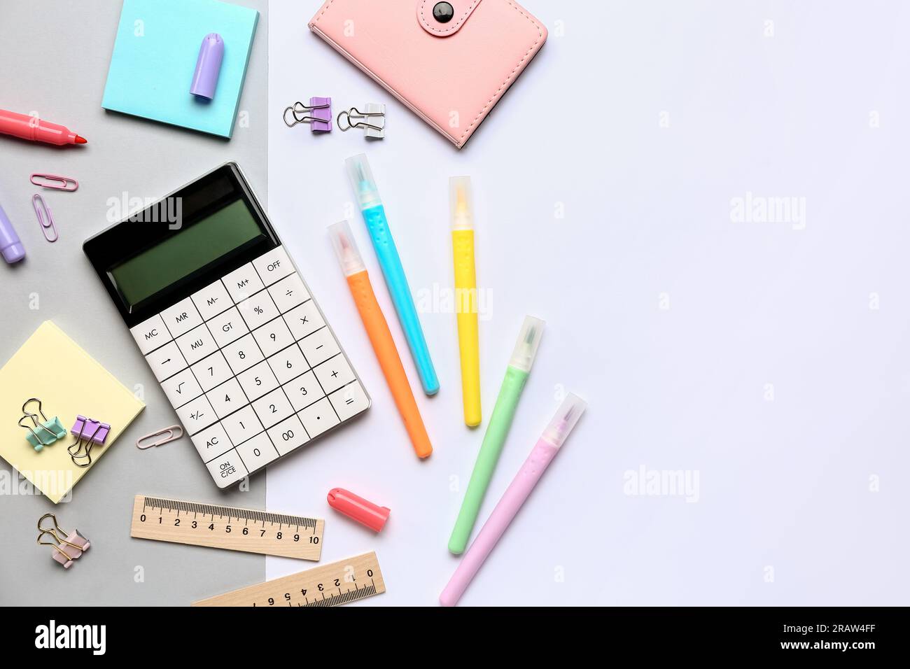 Modern calculator with different stationery on color background Stock Photo