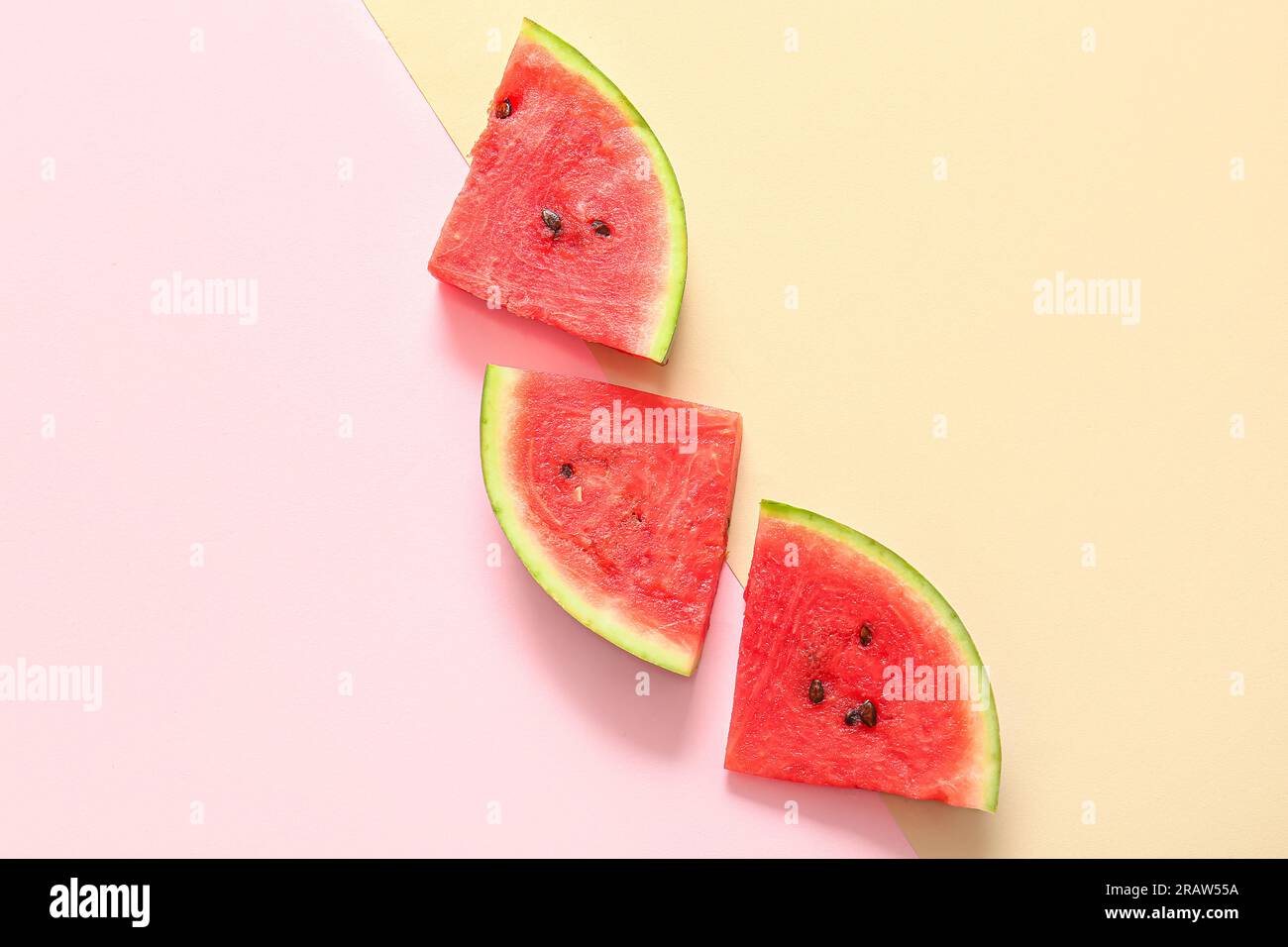 Pieces of fresh watermelon on colorful background Stock Photo - Alamy