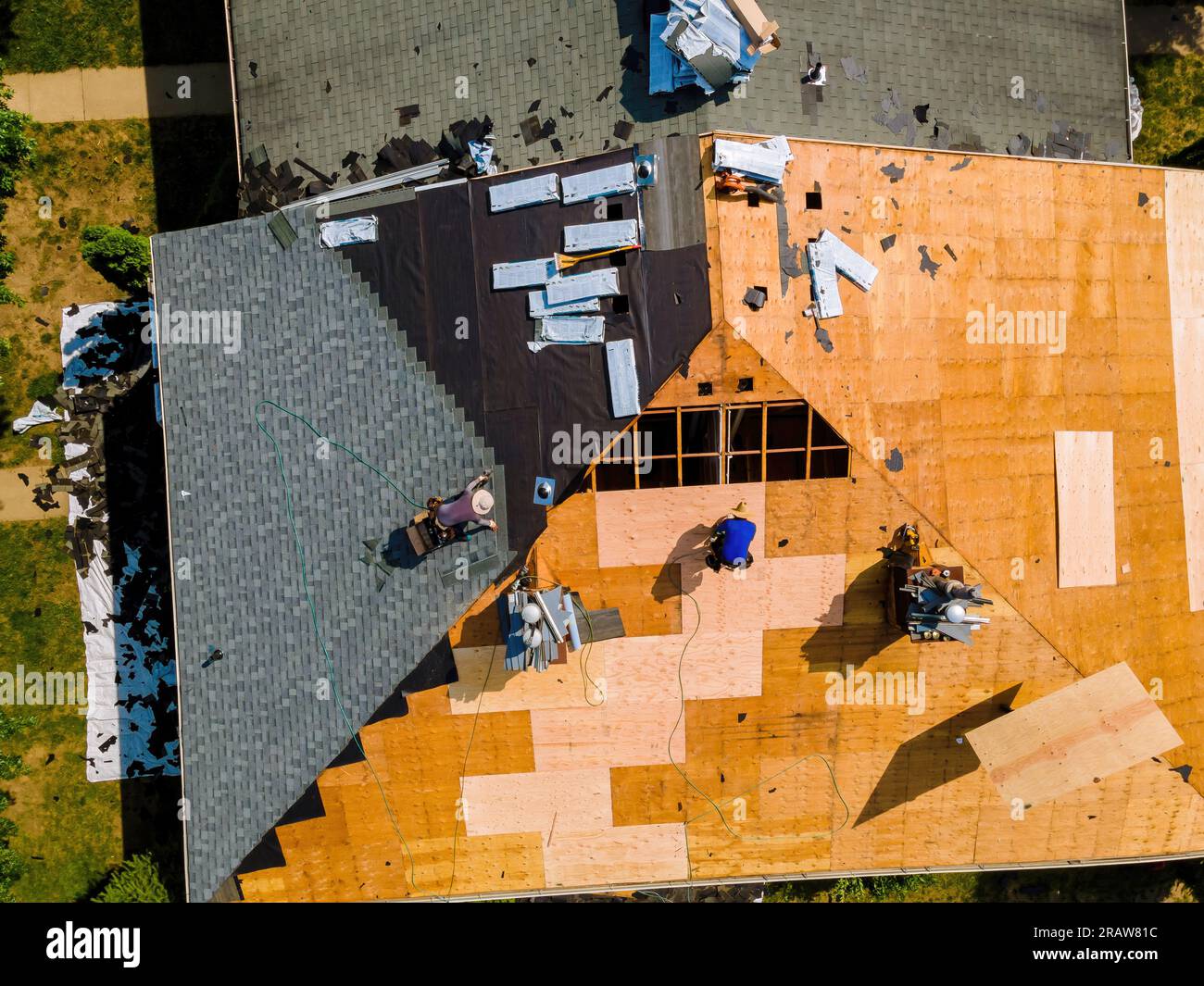 Image showcasing During repair work on apartment buildings roof old shingles were ...