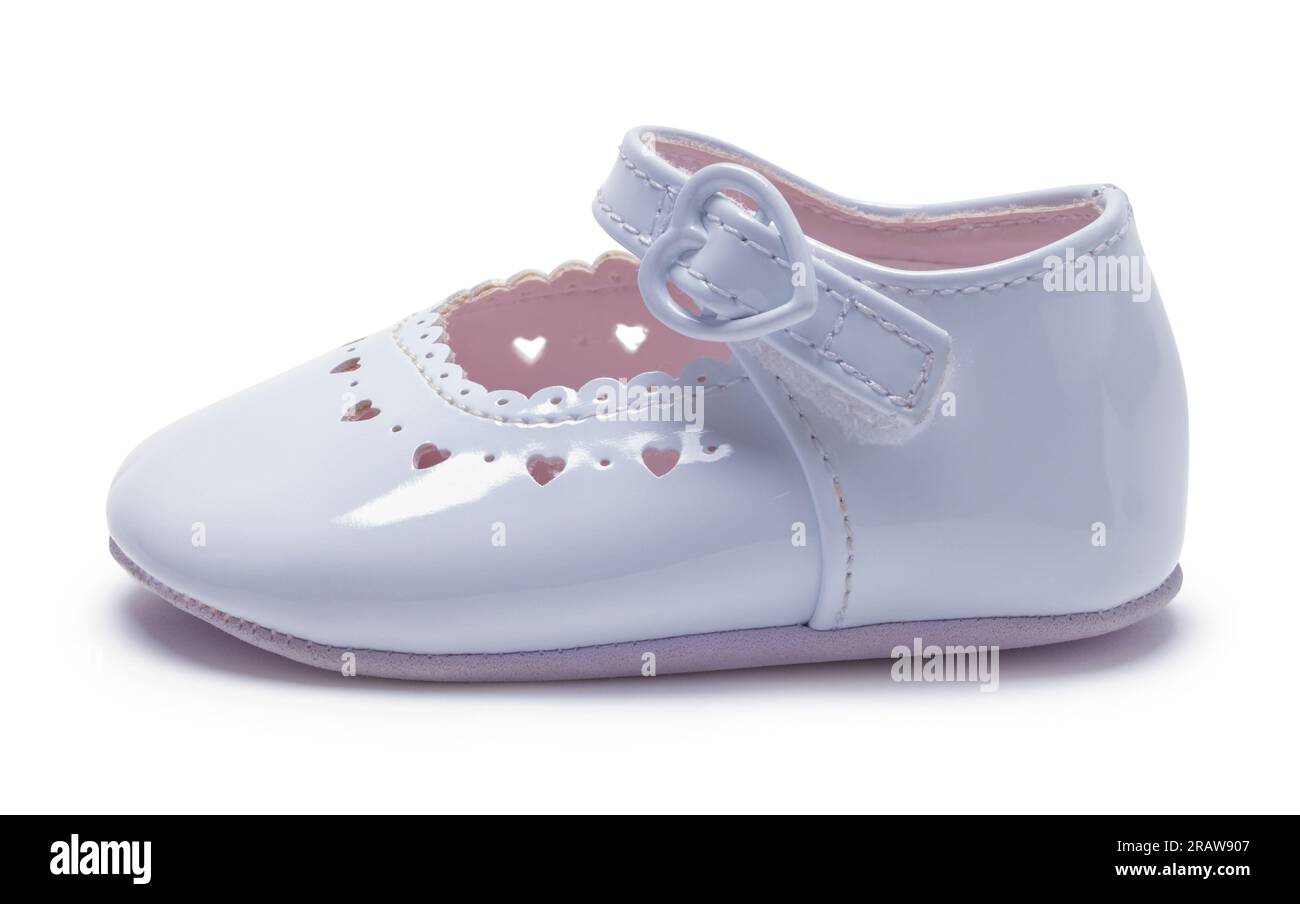 One Girl's Baby Shoe Side View Cut Out on White. Stock Photo