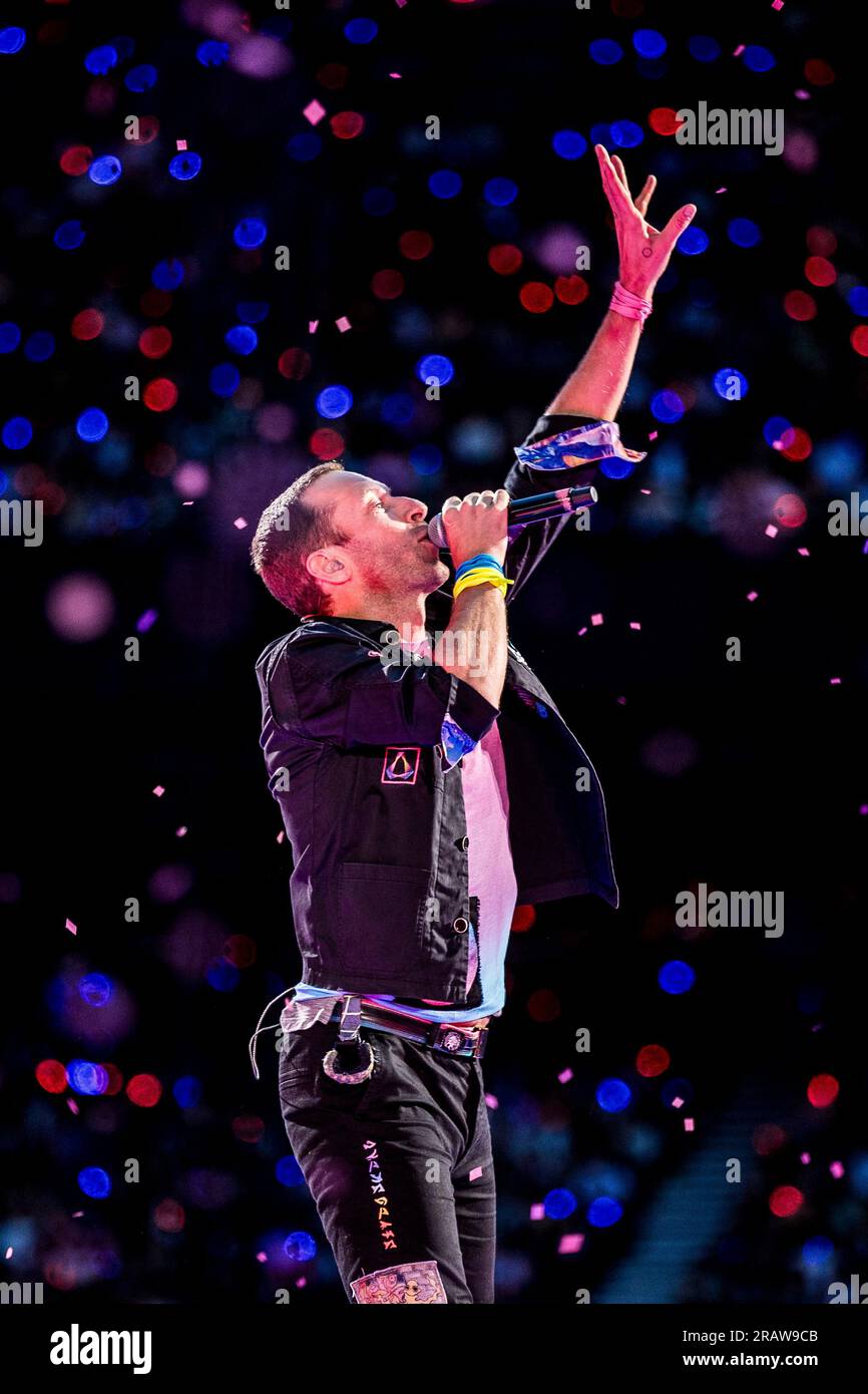 Chris Martin performing live on stage in the year 2023