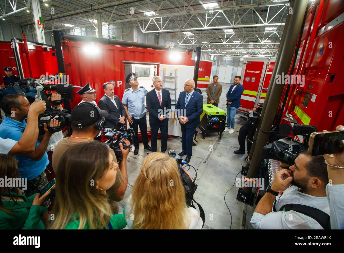 Bucharest, Romania. 5th July, 2023: Adrian Caciu (C-L), Minister of Investments and European Projects, Catalin Predoiu (C), Minister of Internal Affairs, and Raed Arafat (C-R), Secretary of State in the Ministry of Internal Affairs and founder of the Romanian emergency rescue service SMURD, attend the presentation of 15 of the 25 advanced medical stations and four radio support vehicles assigned to the Romanian General Inspectorate for Emergency Situations, purchased within the VISION 2020 project - Large Infrastructure Operational Program (POIM 2014-2020). Credit: Lucian Alecu/Alamy Live News Stock Photo