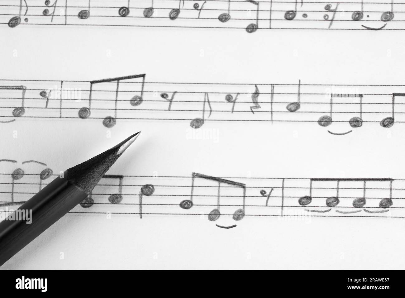 Sheet with musical notes and pencil, top view Stock Photo - Alamy