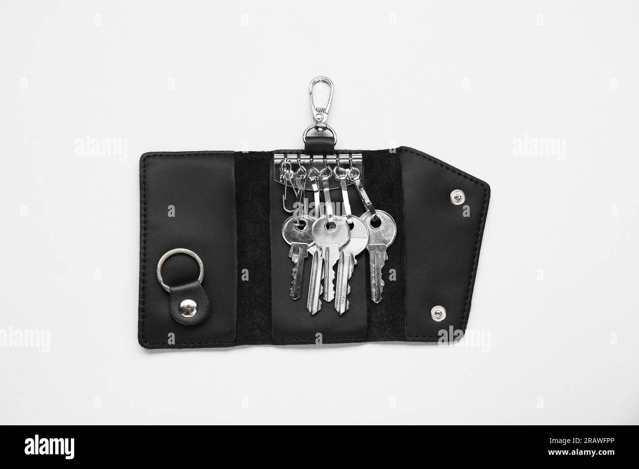 Open leather holder with keys on light grey background, top view Stock Photo