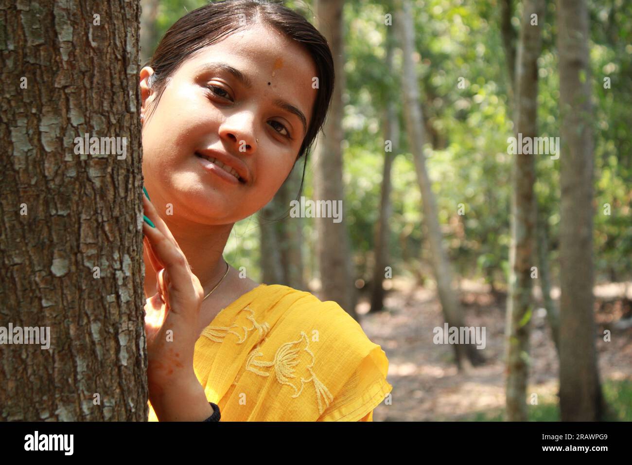 Happy Indian young teenage girl giving toothy smile and looking at camera. Stock Photo