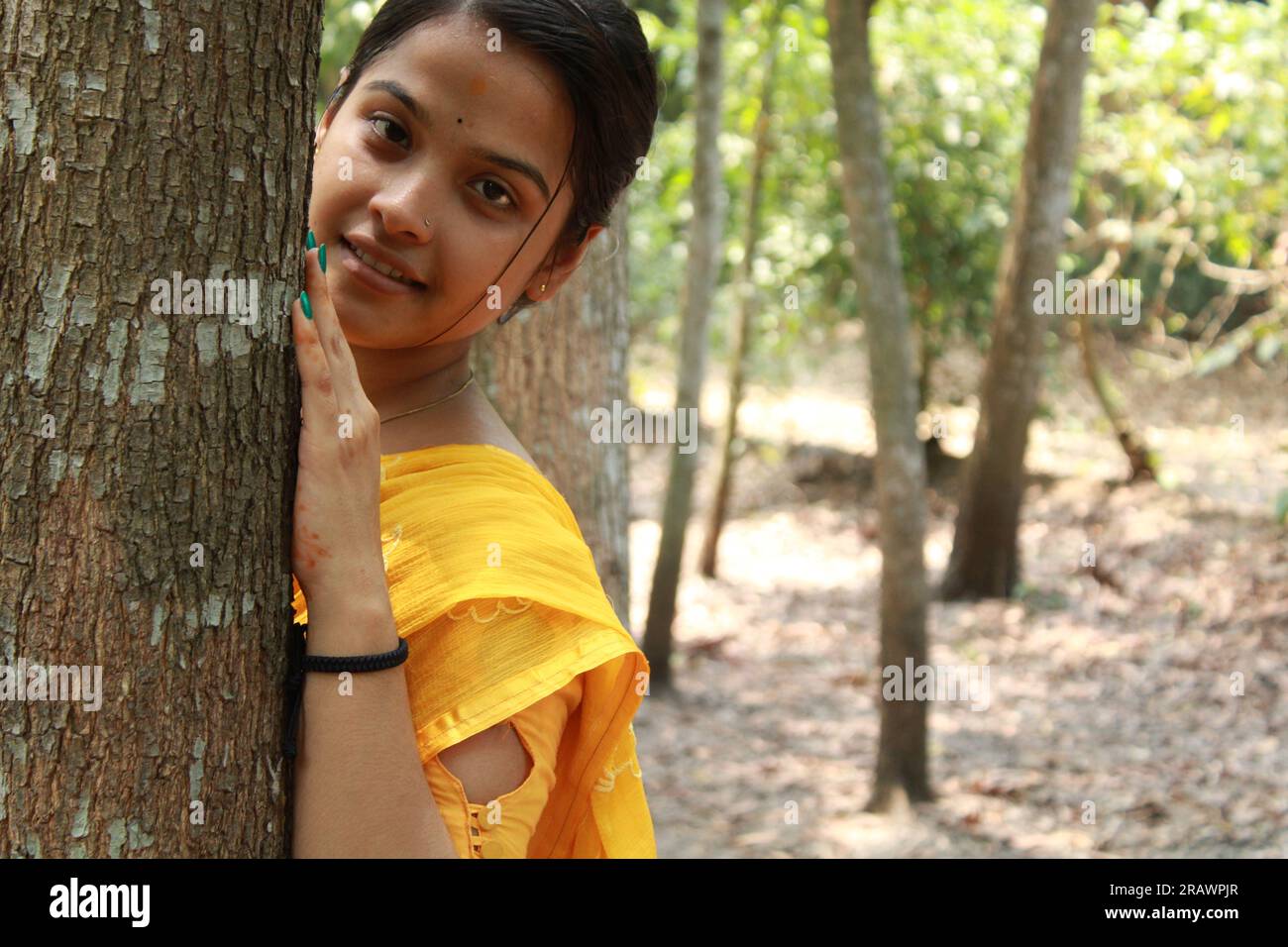 Happy Indian young teenage girl giving toothy smile and looking at camera. Stock Photo