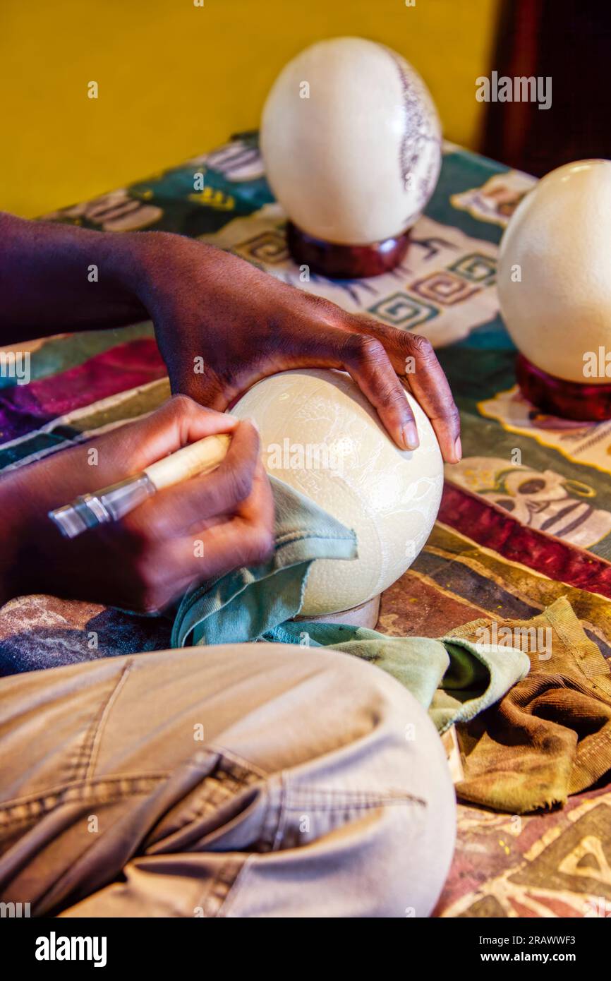 african craftsman carving traditionally by hand an ostrich shell Stock ...