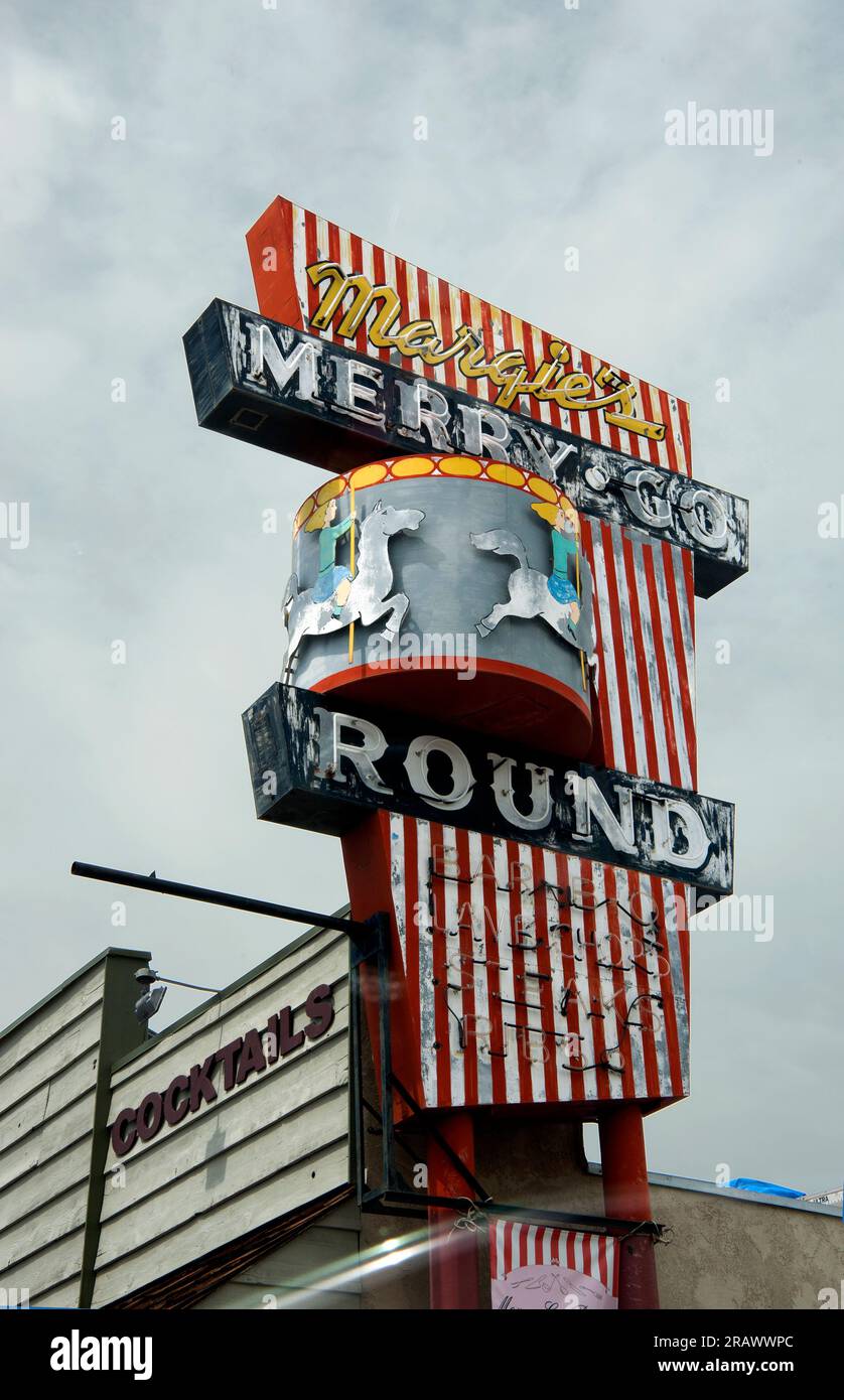 Vintage roadside signs for Margie’s Merry Go Round restaurant on scenic Route 395 as it passes through Lone Pine, California Stock Photo