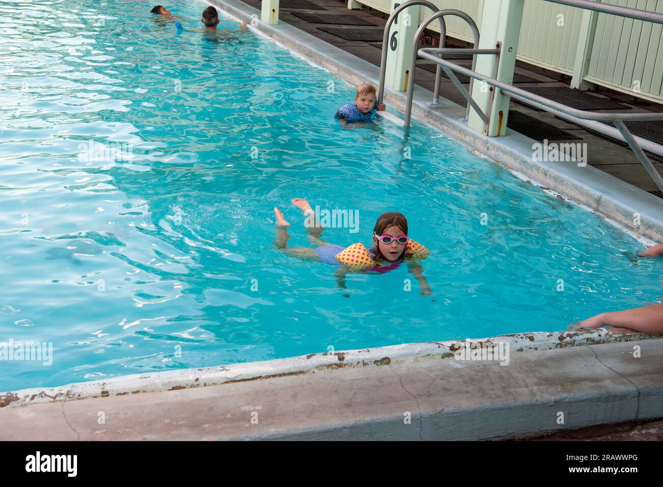 Kids enjoying the hot mineral bath water in pool at Keough's Hot