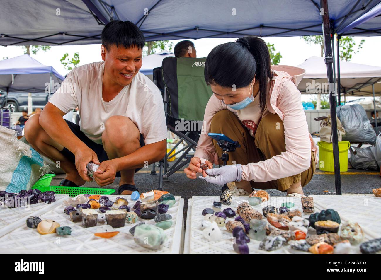https://c8.alamy.com/comp/2RAWX03/lianyungang-china-july-6-2023-the-crystal-market-is-crowded-in-donghai-county-lianyungang-city-jiangsu-province-china-july-6-2023-the-crystal-collection-can-provide-more-than-3600-ground-stalls-which-are-divided-into-stone-ball-area-basin-pendante-area-carved-parts-area-and-bracelet-semi-finished-products-area-it-is-understood-that-donghai-county-is-known-as-the-crystal-capital-of-the-world-the-donghai-crystal-has-been-approved-by-the-national-geographic-indication-protection-products-with-a-number-of-crystal-crystal-products-based-on-the-open-air-collection-become-a-usef-2RAWX03.jpg