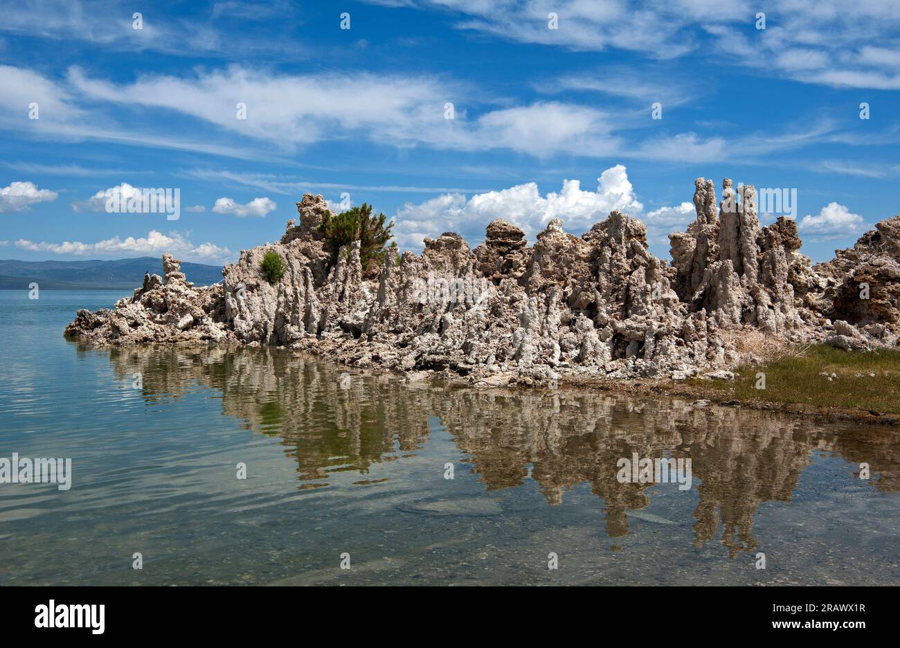 Tufas and reflections in water at Mono Lake, California Stock Photo