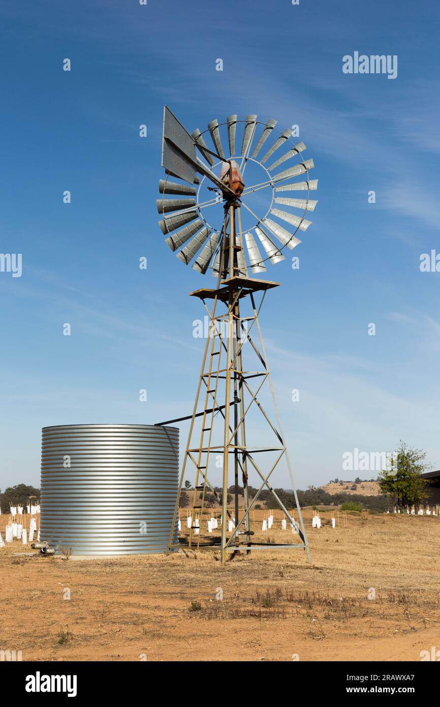 Old Australian Windmill Pumping Water In Desert Landscape Stock Photo Alamy