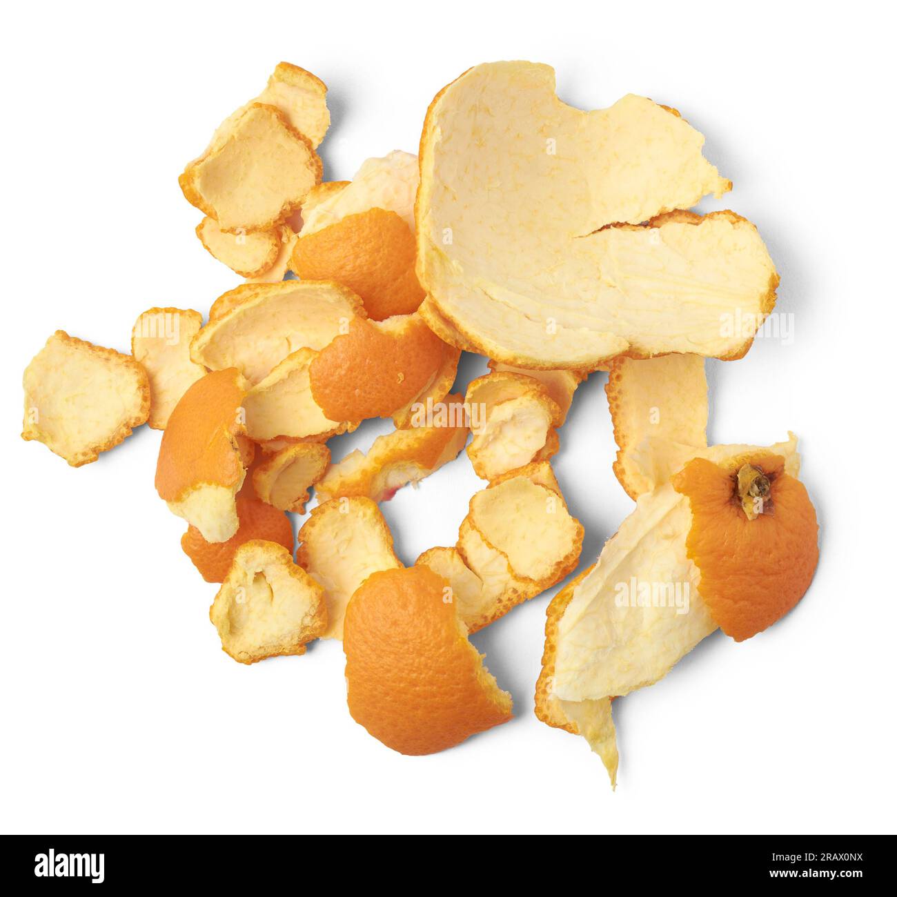 orange peel scattered, isolated on white background, thick orange colored skin covers the fruits
