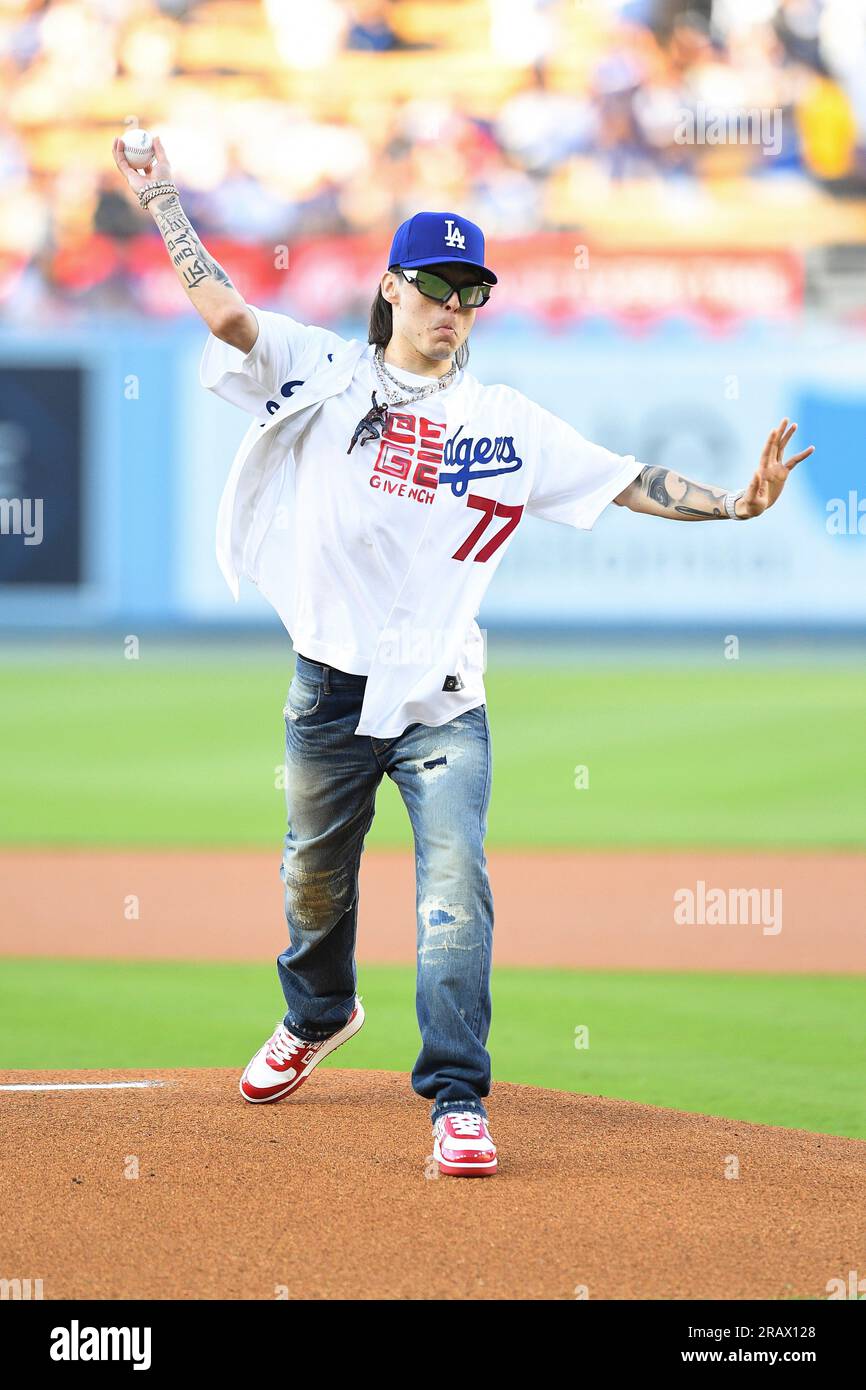LOS ANGELES, CA - JULY 05: Rapper Peso Pluma looks on throws out the first  pitch before the MLB game between the Pittsburgh Pirates and the Los  Angeles Dodgers on July 5