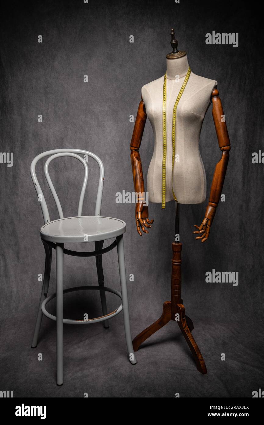 Wooden female dressmakers mannequin, retro style with arms and adjustable stand Stock Photo
