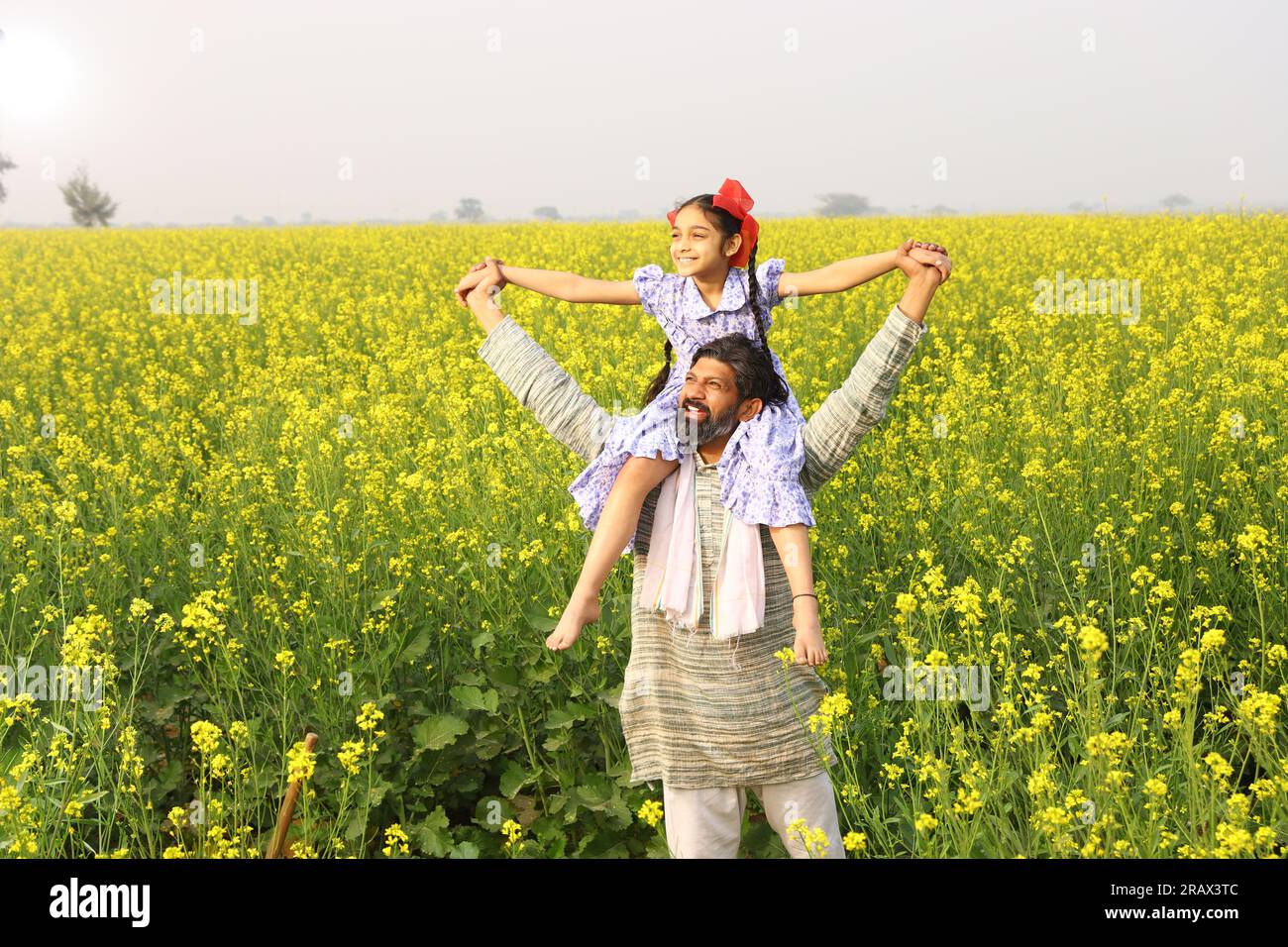 Happy rural Indian father and daughter enjoying together while playing ...