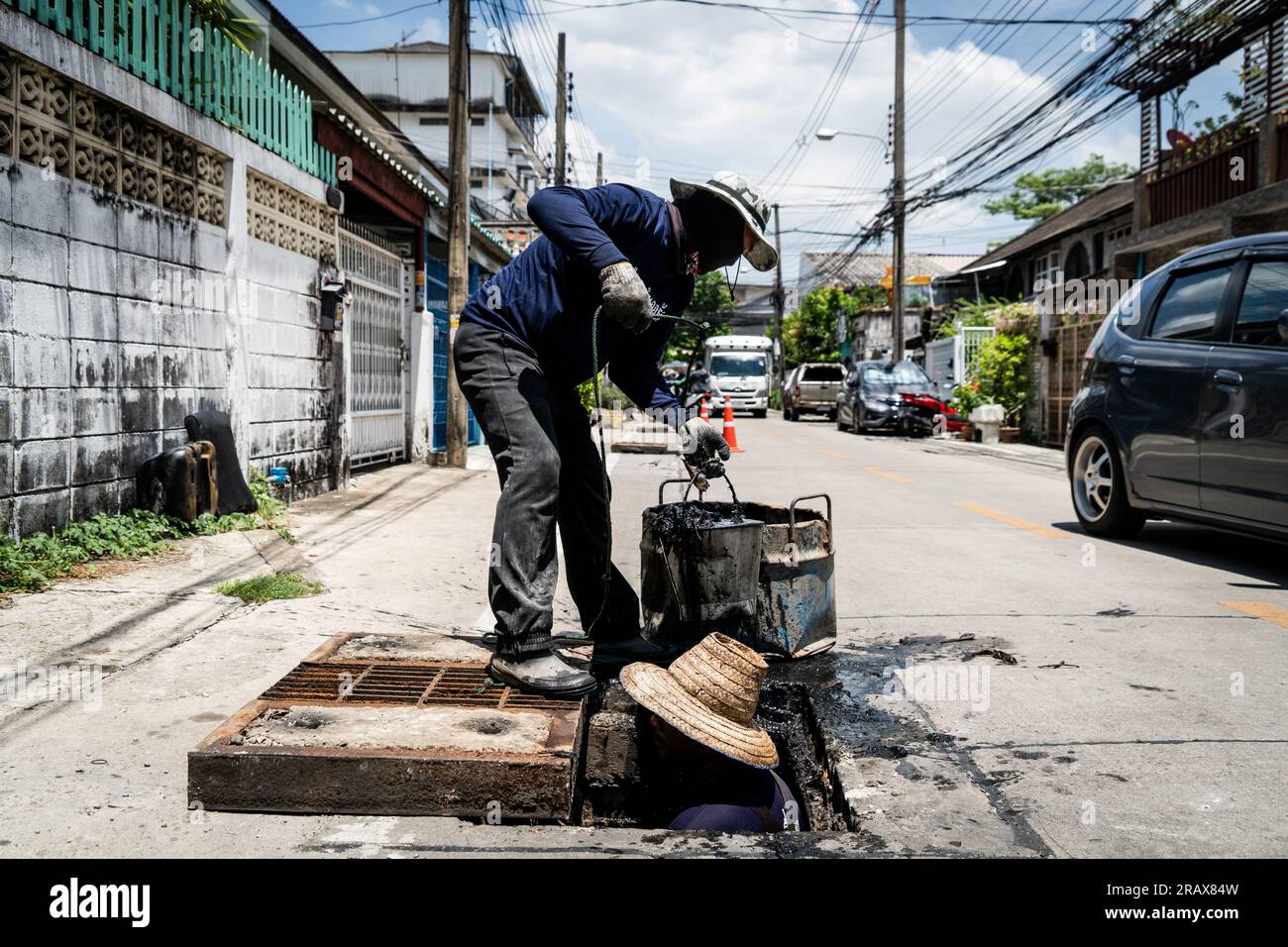 Bangkok, Thailand. 06th July, 2023. An inmate standing in a city drain