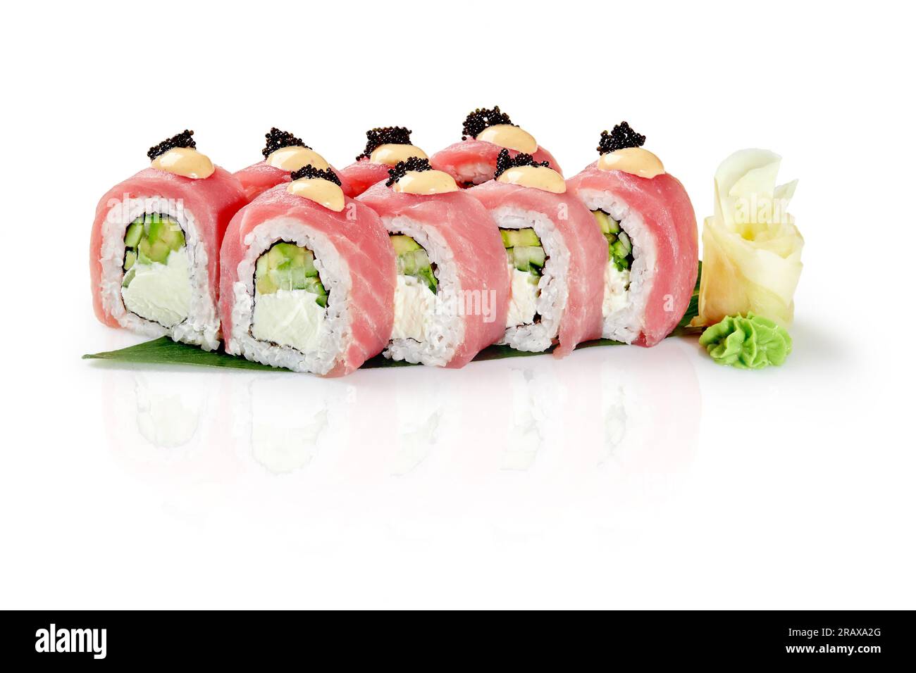 Philadelphia rolls with tuna, spicy sauce and black tobiko on bamboo
