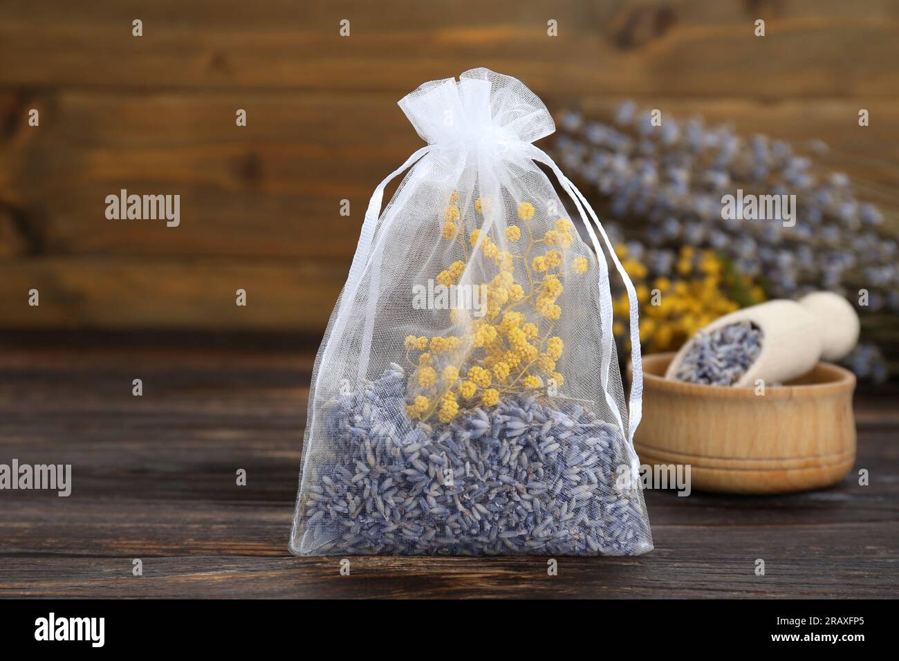 Scented sachet with flowers and stylish clothes on hanger Stock Photo -  Alamy