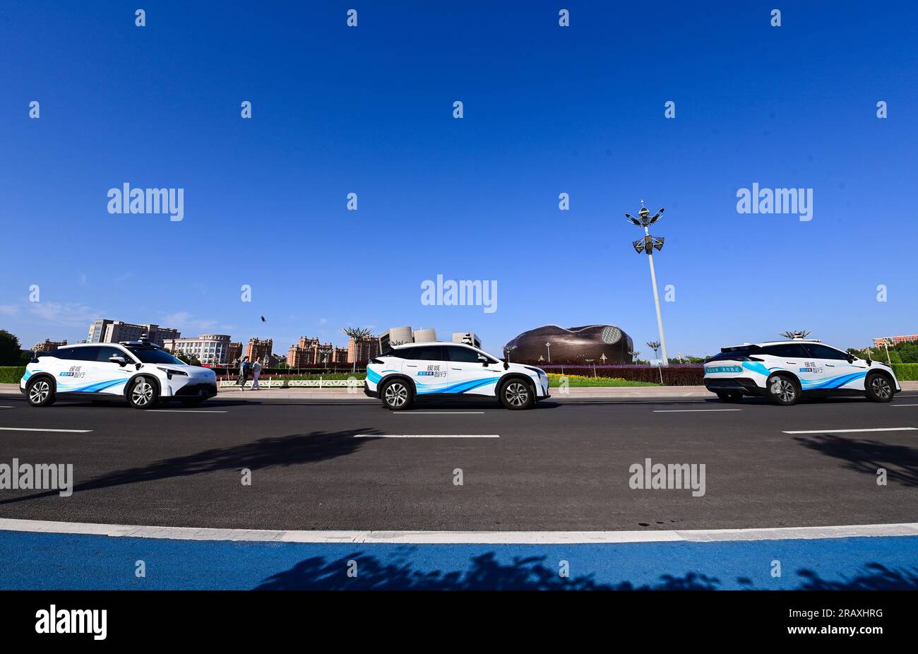 ORDOS, CHINA - JULY 6, 2023 - Self-driving taxis are tested on a street in Ordos, Inner Mongolia, China, July 6, 2023. In recent years, Ordos City Kan Stock Photo