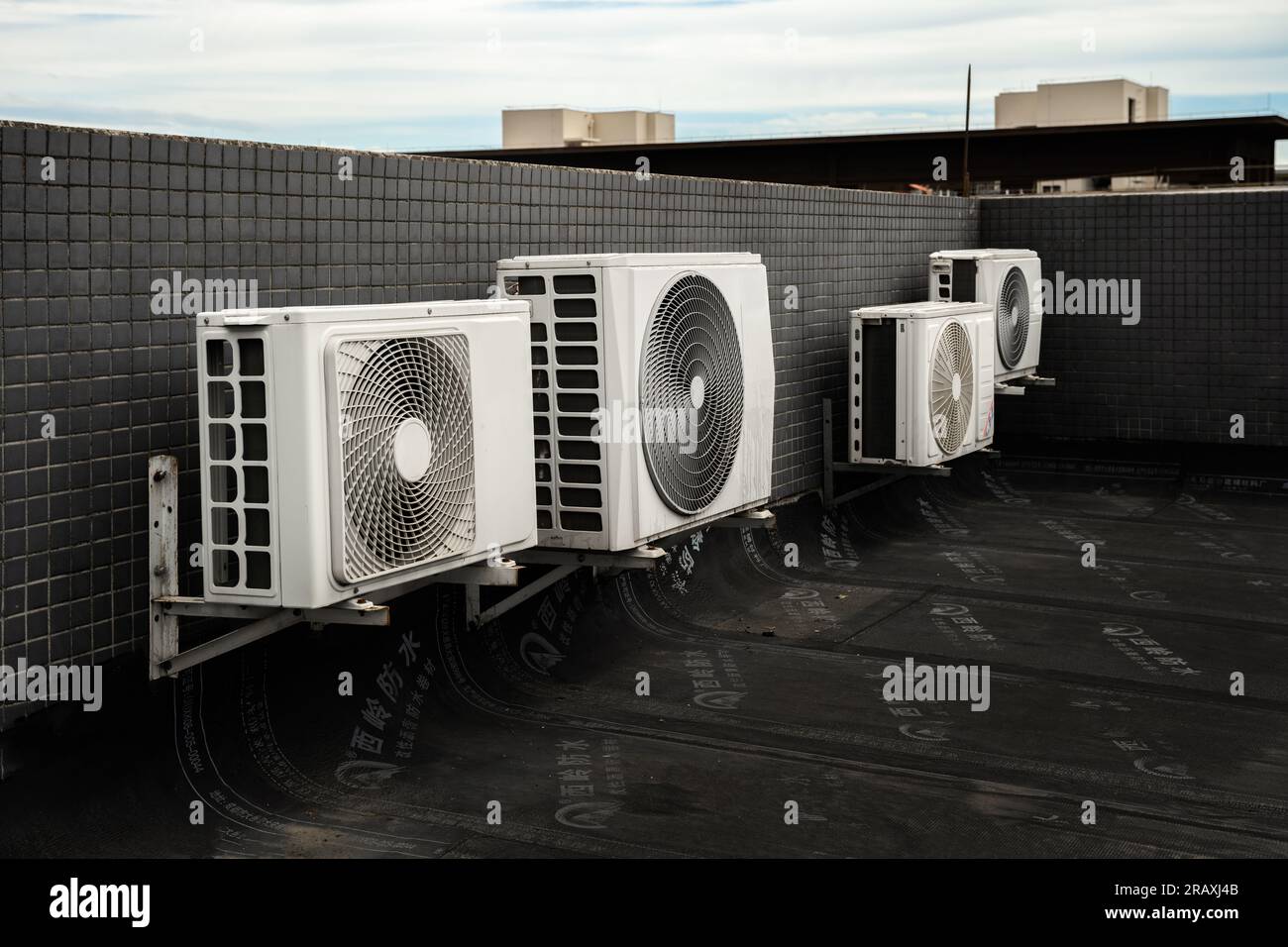 The air conditioning outdoor unit placed on the rooftop. Stock Photo