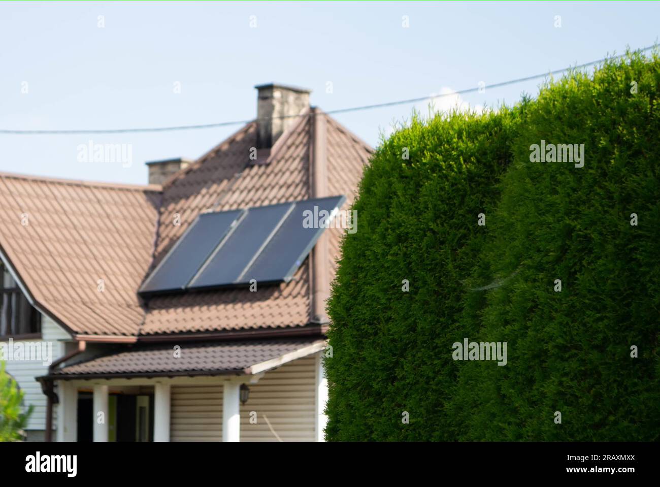 View of Historic farm house with modern solar panels on roof and wall High ...