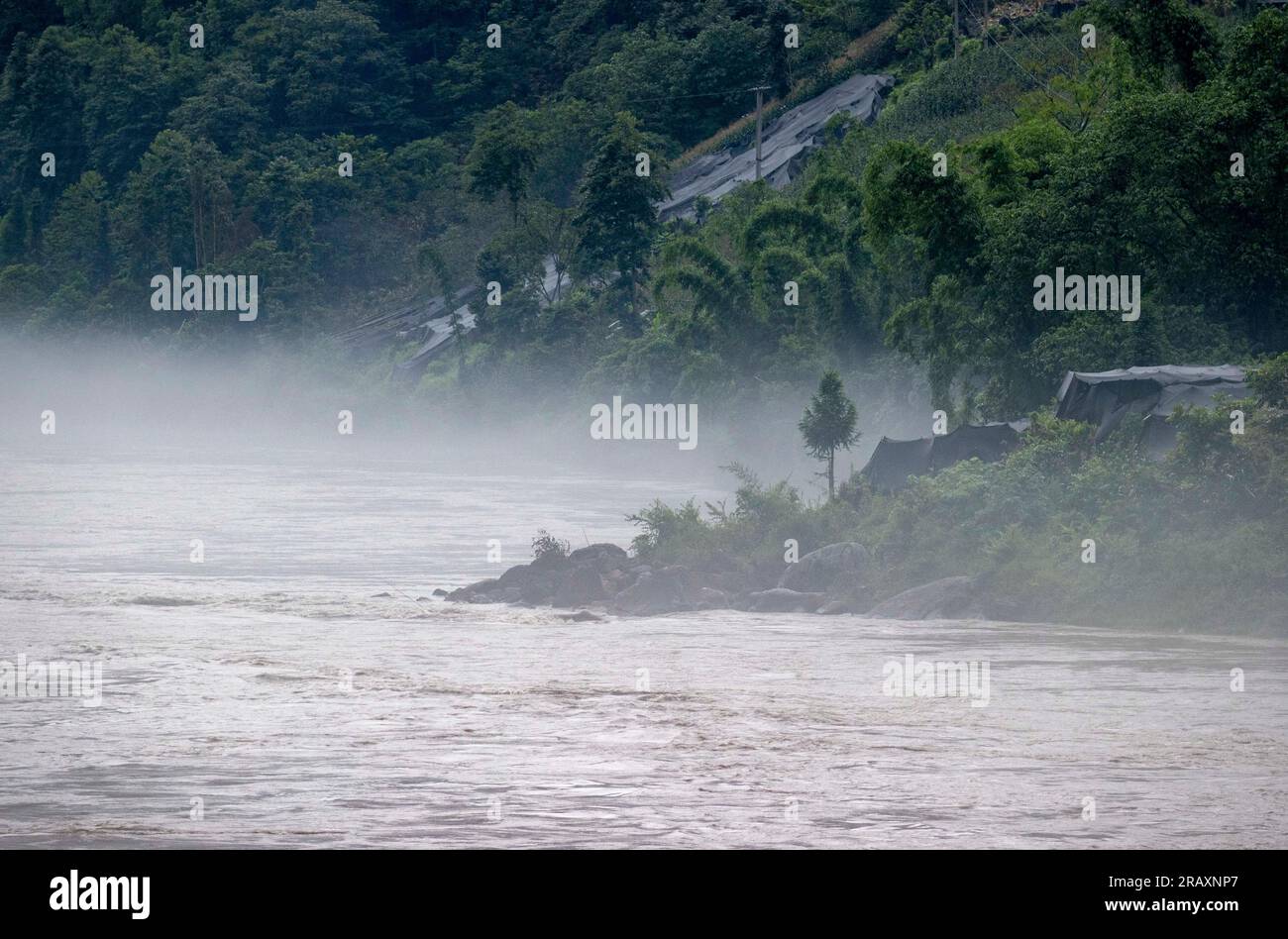 Gongshan. 4th July, 2023. This photo taken on July 4, 2023 shows the scenery of the Nujiang River in Nujiang Lisu Autonomous Prefecture, southwest China's Yunnan Province. Credit: Yang Zhisen/Xinhua/Alamy Live News Stock Photo