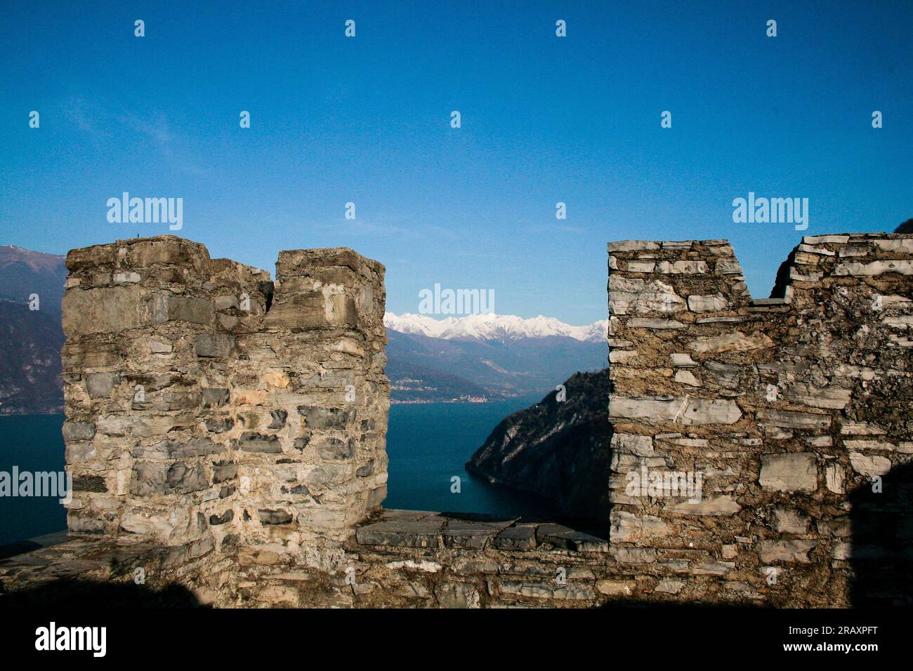 Perledo, Province of Lecco, region Lombardy, eastern shore of Lake of Como, Italy. Castello di Vezio. The castle, dating back to the 11th century AD, overlooks and dominates the eastern shore of Lake Como. Inside the building there is also a falconry. The castle walls, view of mountains and lake. Stock Photo