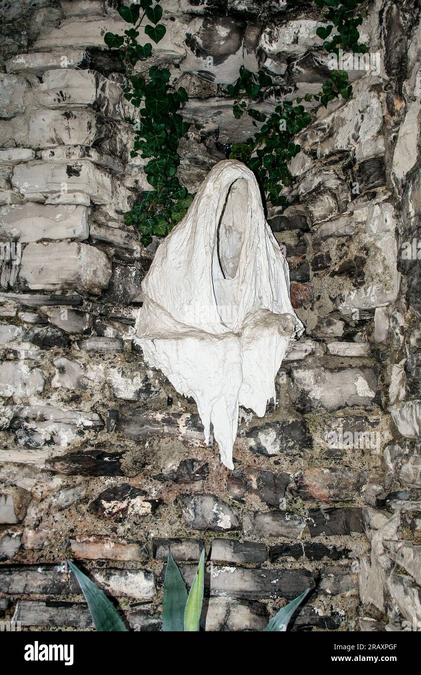Perledo, Province of Lecco, region Lombardy, eastern shore of Lake of Como, Italy. Castello di Vezio. The castle, dating back to the 11th century AD, overlooks and dominates the eastern shore of Lake Como. Inside the building there is also a falconry. A gauze and plaster statue depicting a ghost. Stock Photo