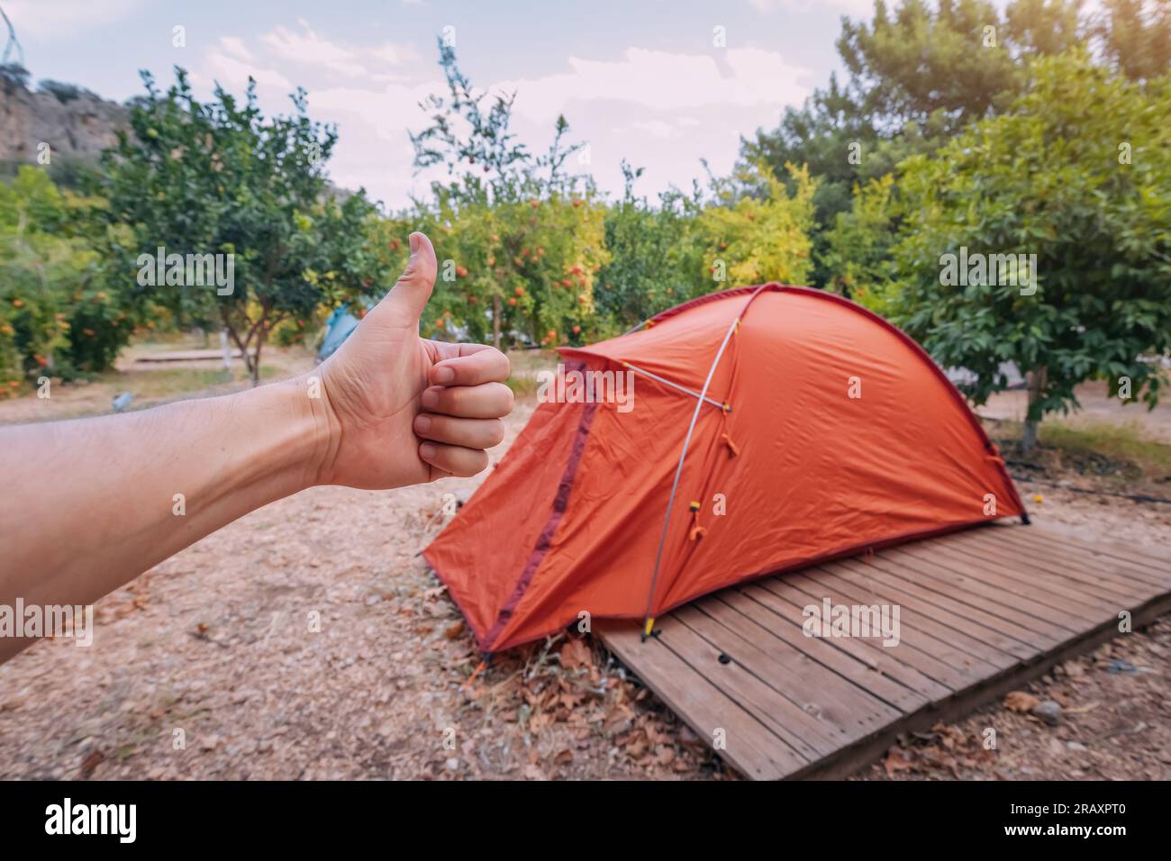Assembling and installing a tent in a camping. Equipment and materials for hiking Stock Photo