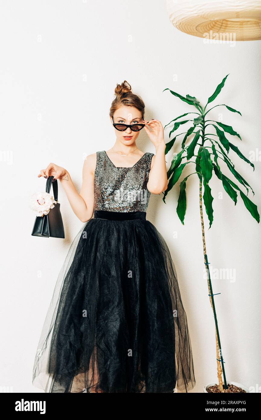 Woman wearing long black dress hi-res stock photography and images - Alamy