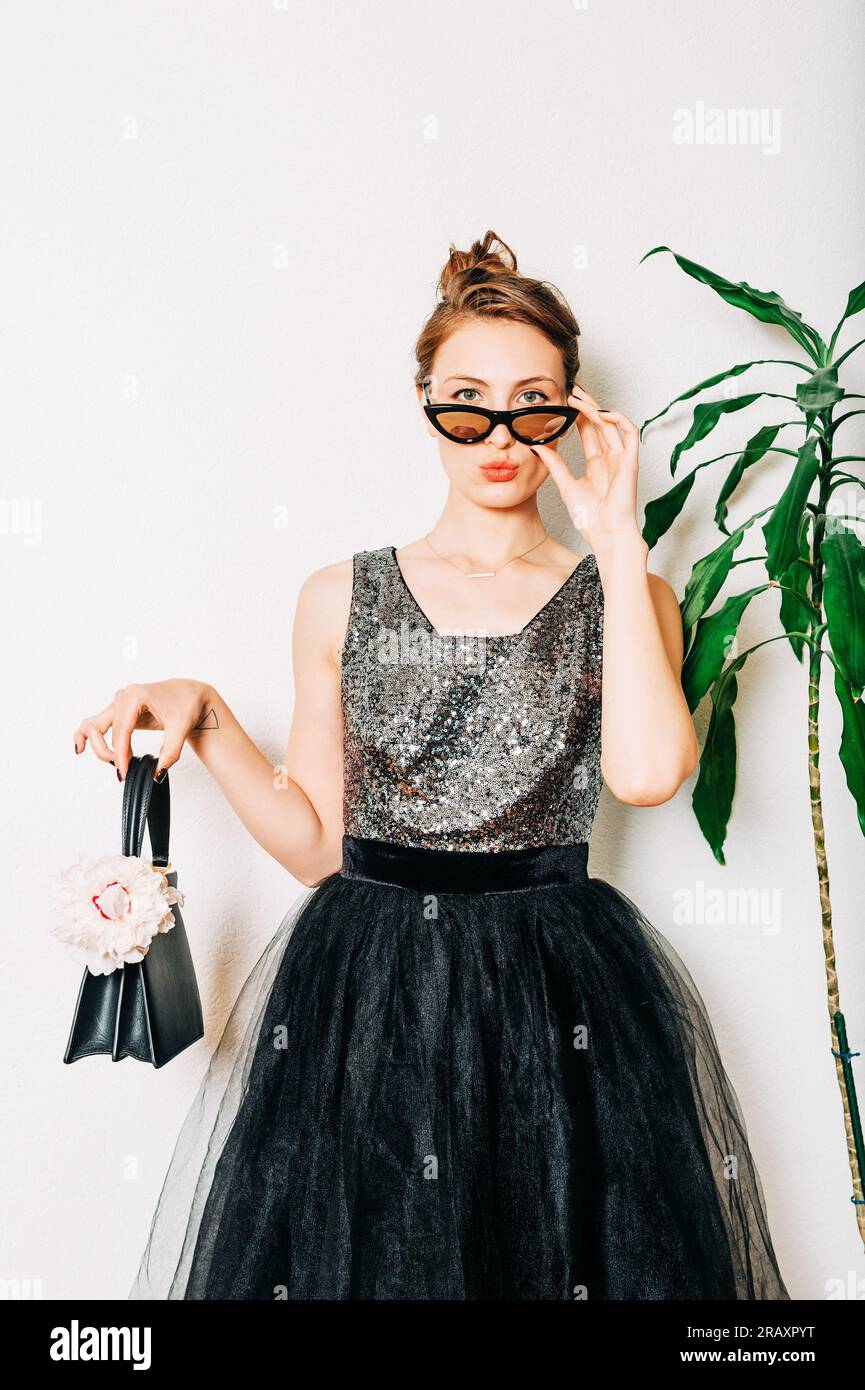 Woman wearing long black dress hi-res stock photography and images - Alamy