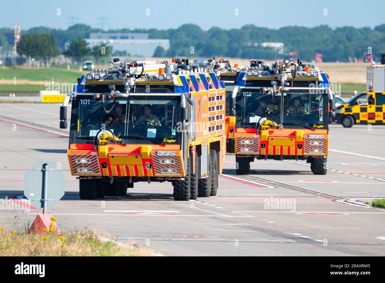 Hamburg, Germany. 06th July, 2023. Vehicles of the airport fire department on the airfield. Due to a smoking stove, an aircraft en route to Istanbul landed back in Hamburg shortly after takeoff. A spokesman for Turkish Airlines confirmed to Deutsche Presse-Agentur on Thursday morning that the Airbus A 321 had to turn around and land back in Hamburg due to a 'technical problem'. Credit: Jonas Walzberg/dpa/Alamy Live News Stock Photo