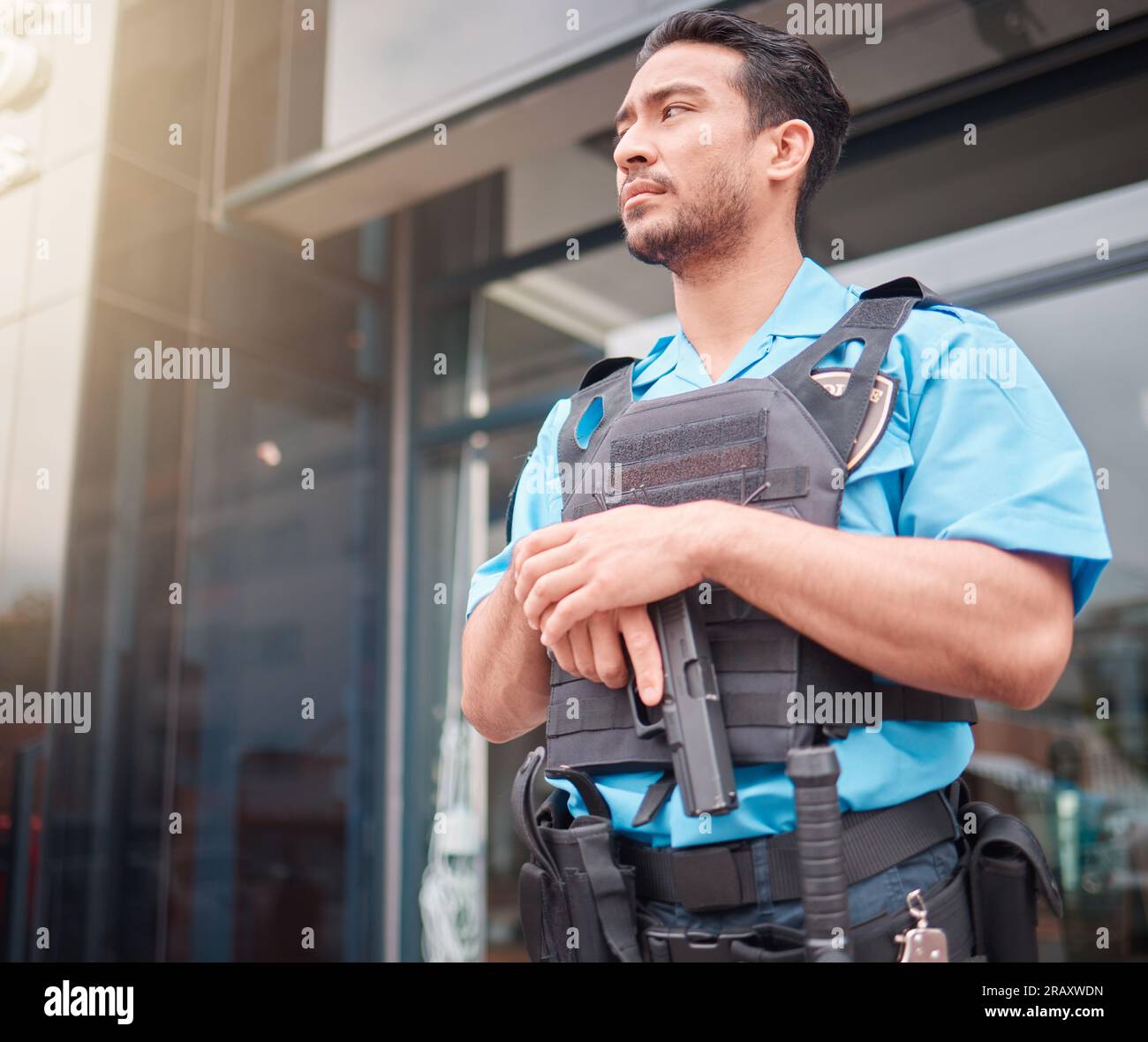 Security guard, safety officer and bodyguard man with a gun outdoor to