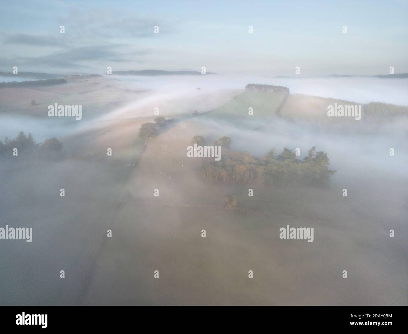 Autumn mist covers the hills and valleys near Aston on Clun, Craven Arms, South Shropshire, England, UK Stock Photo