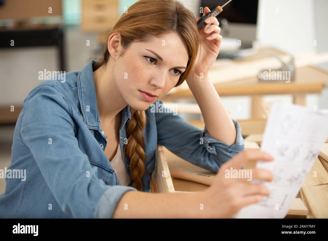 self employed female carpenter planning diy project i Stock Photo